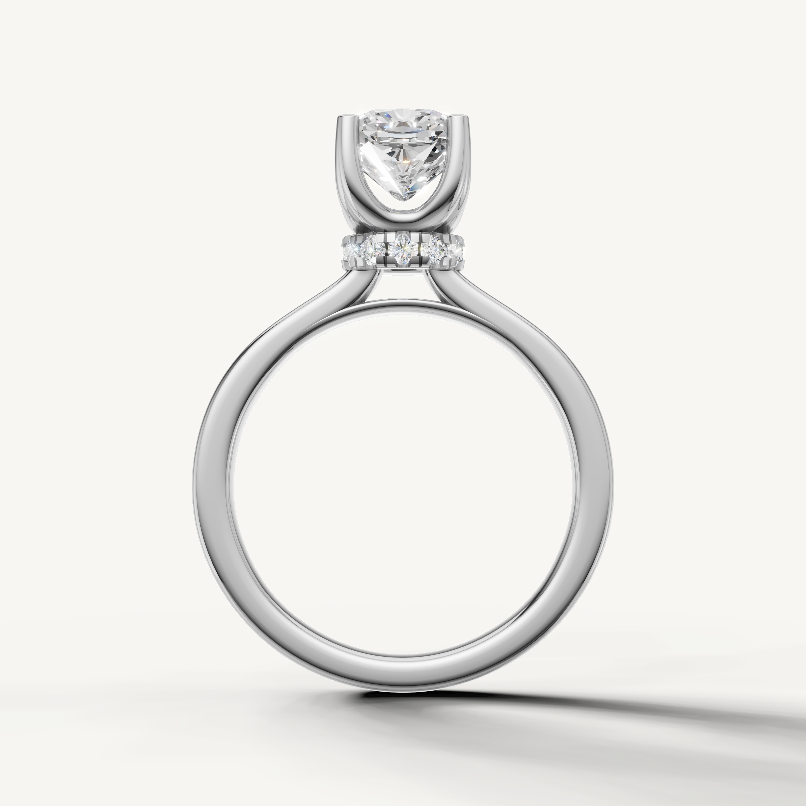 A high-clarity cushion-cut engagement ring crafted in radiant white gold for a timeless, elegant, and bright look.