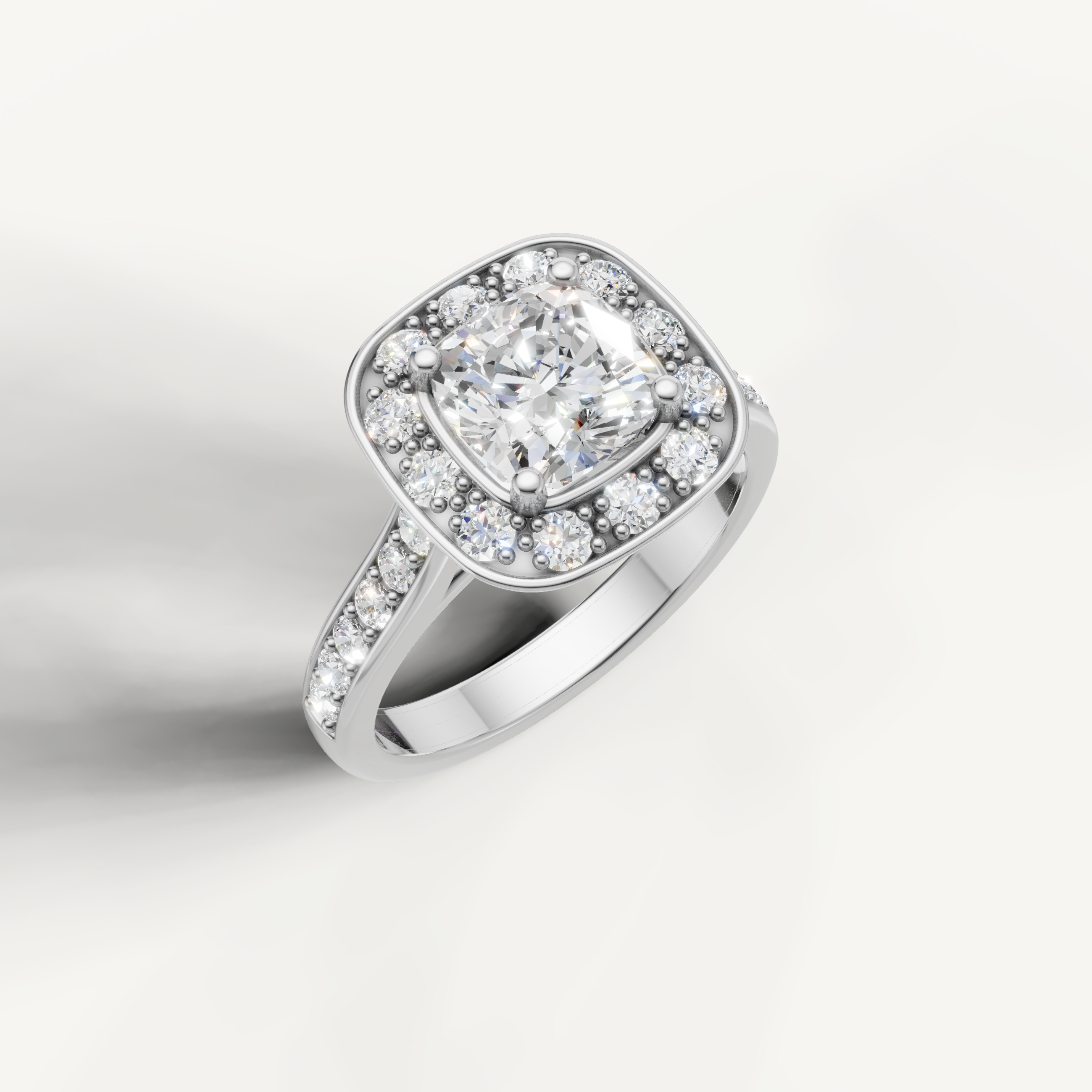 Raul Diamonds white gold cushion halo diamond ring with timeless elegance.