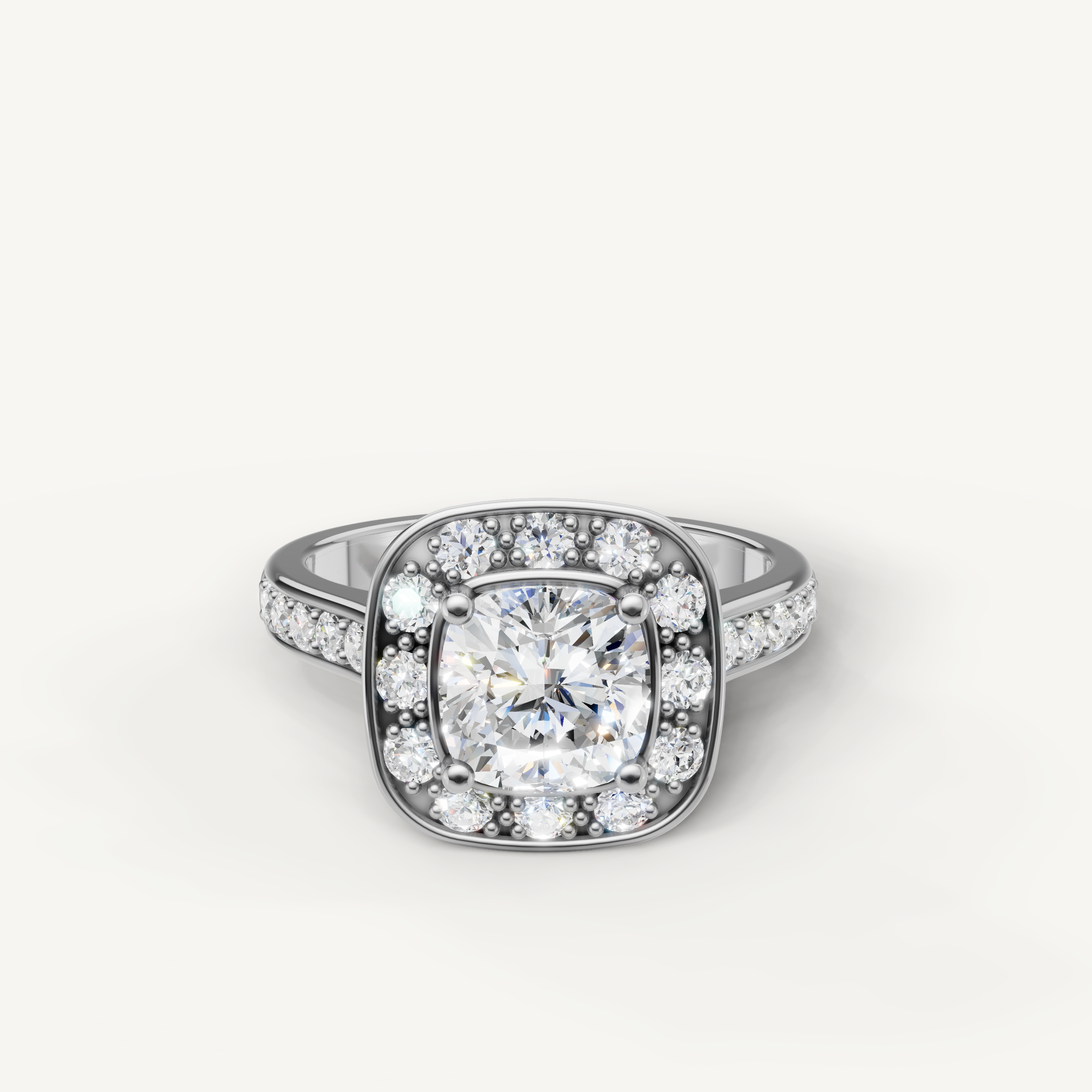 White gold cushion cut halo engagement ring with sparkling side diamonds by Raul Diamonds.