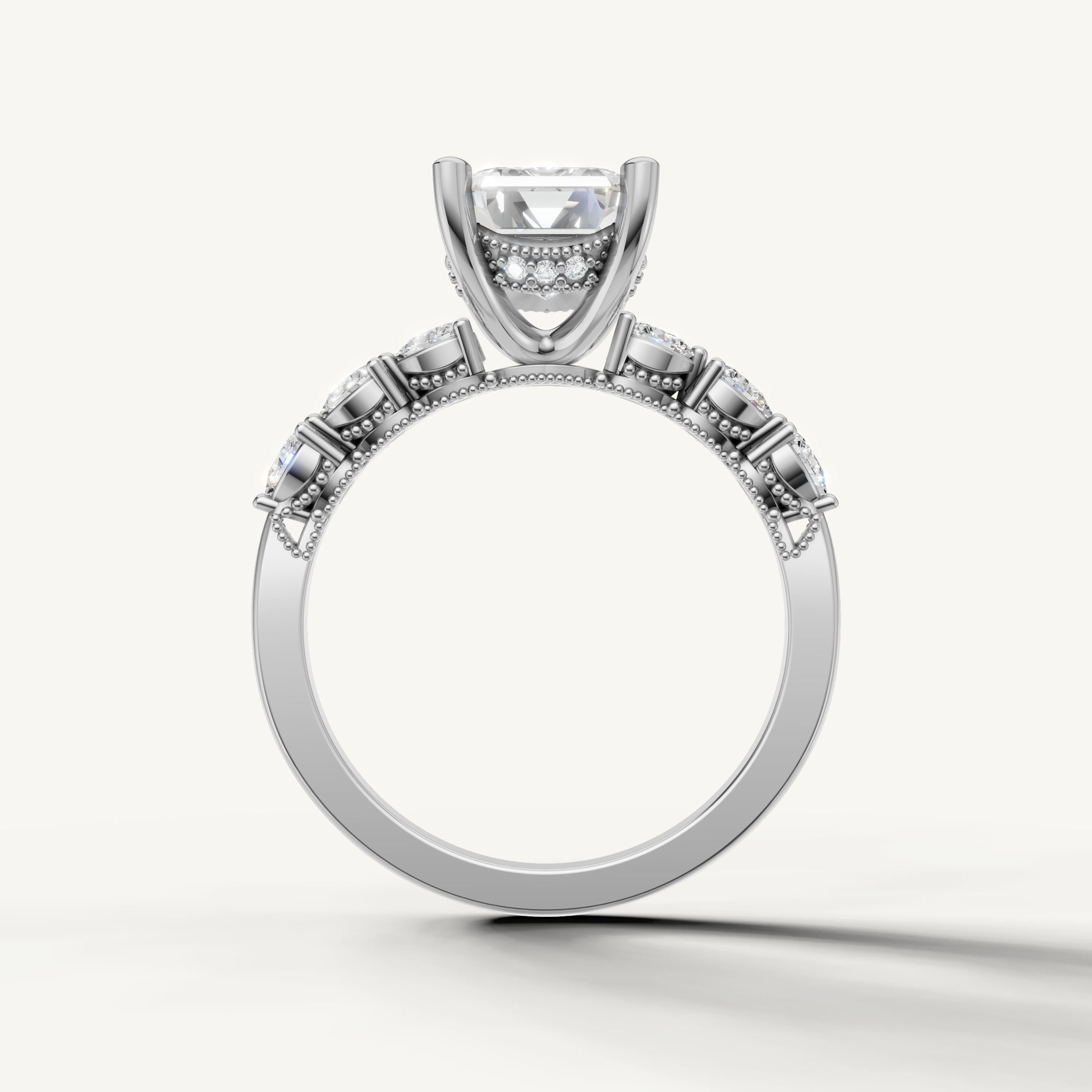 emerald diamond engagement ring with art deco marquise and baguette side stones white gold