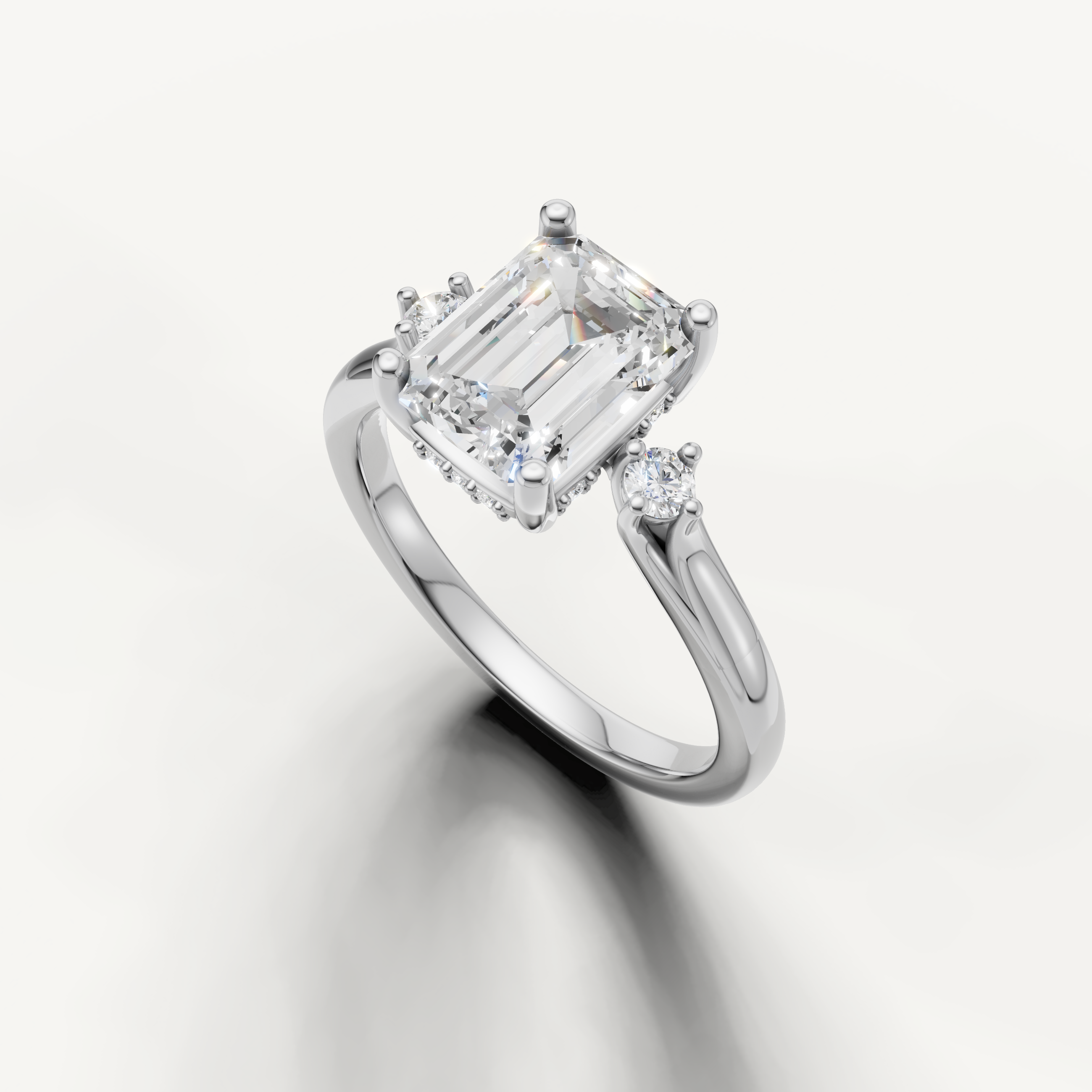 Raul Diamonds white gold emerald cut engagement ring with luxurious three stone setting