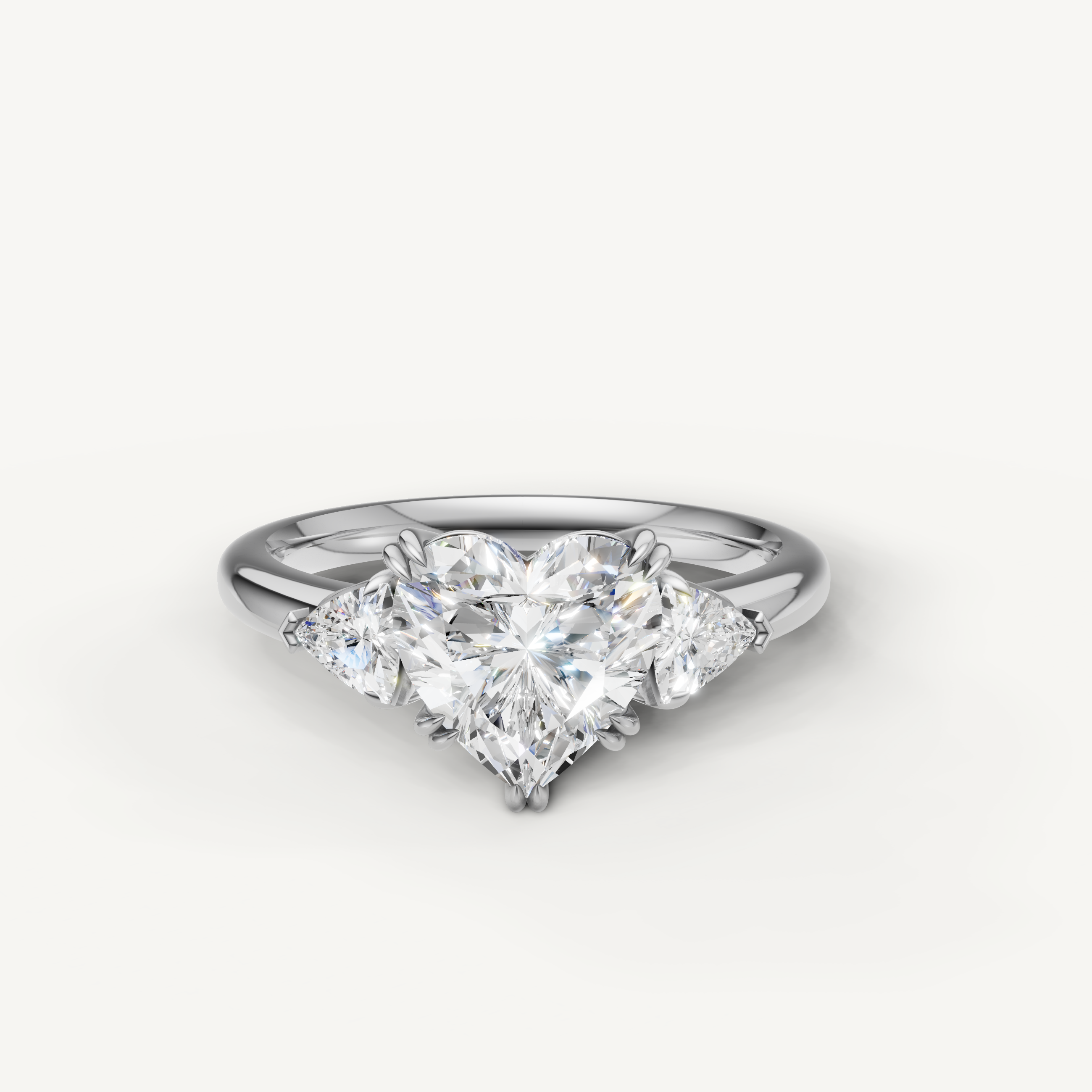heart shaped lab grown diamond engagement ring with trillion side stones in 14k white gold
