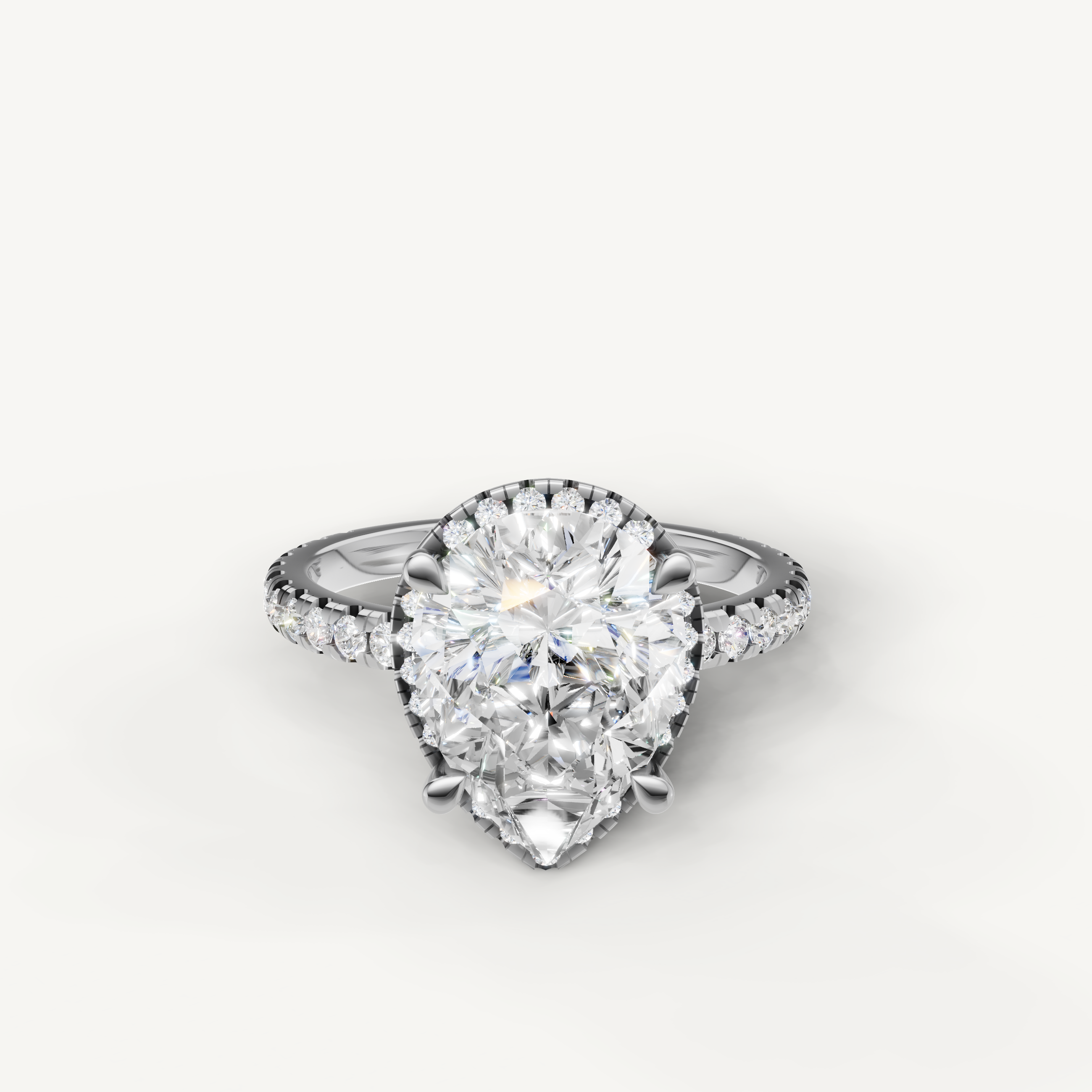 Pear cut lab grown diamond engagement ring with hidden halo pavé band white gold