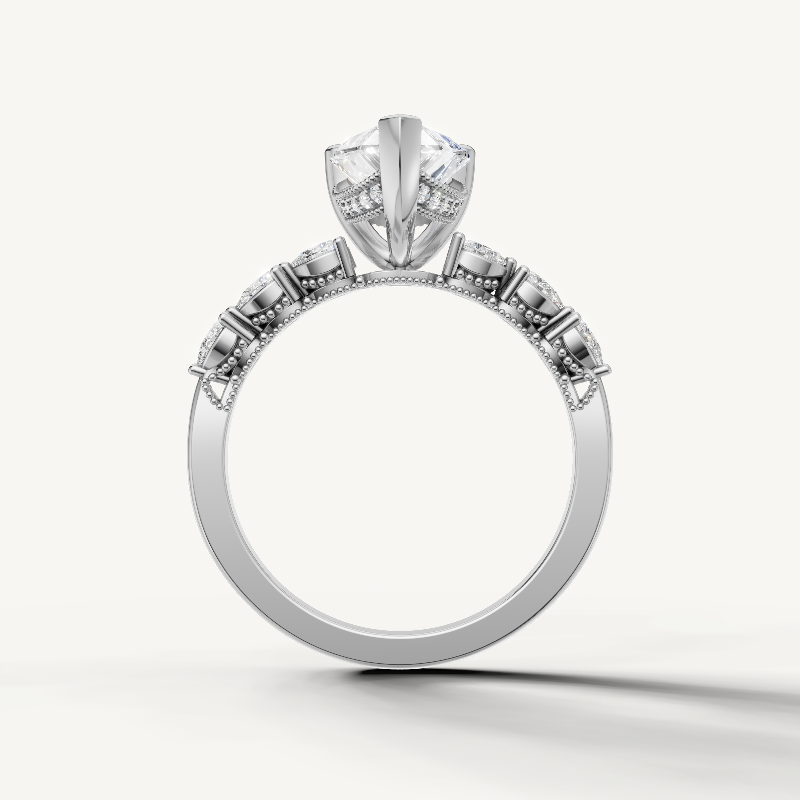 Pear shaped lab grown diamond solitaire ring in white gold with marquise accent diamonds by Raul Diamonds
