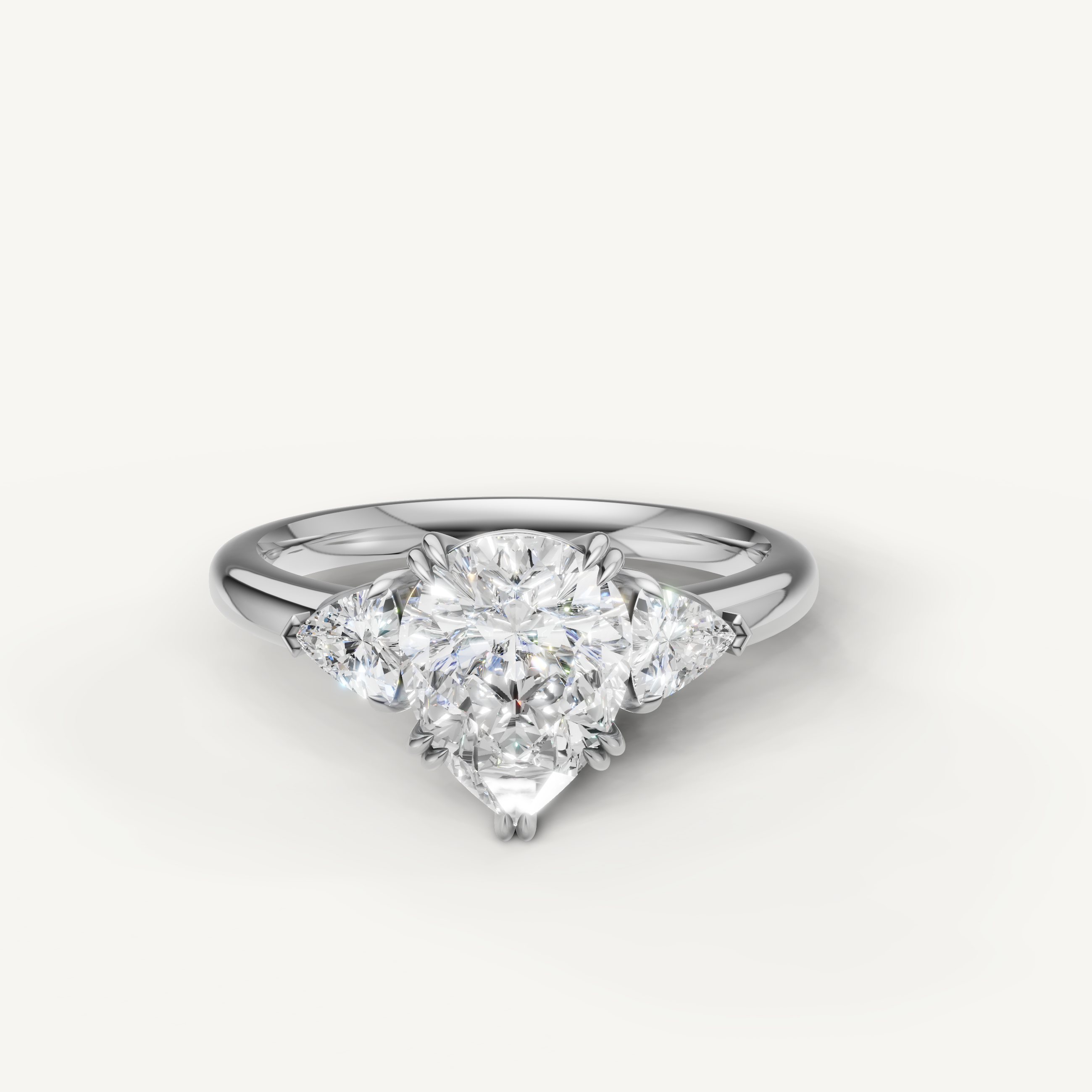 pear cut lab grown diamond engagement ring with trillion side stones in 14k white gold