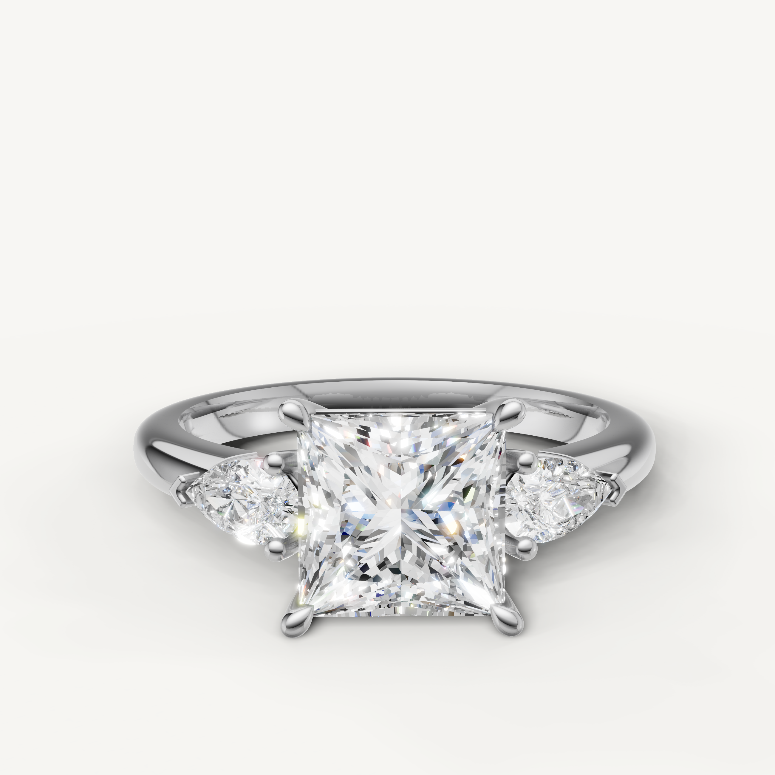 princess cut lab grown diamond engagement ring with pear side stones in 14k white gold