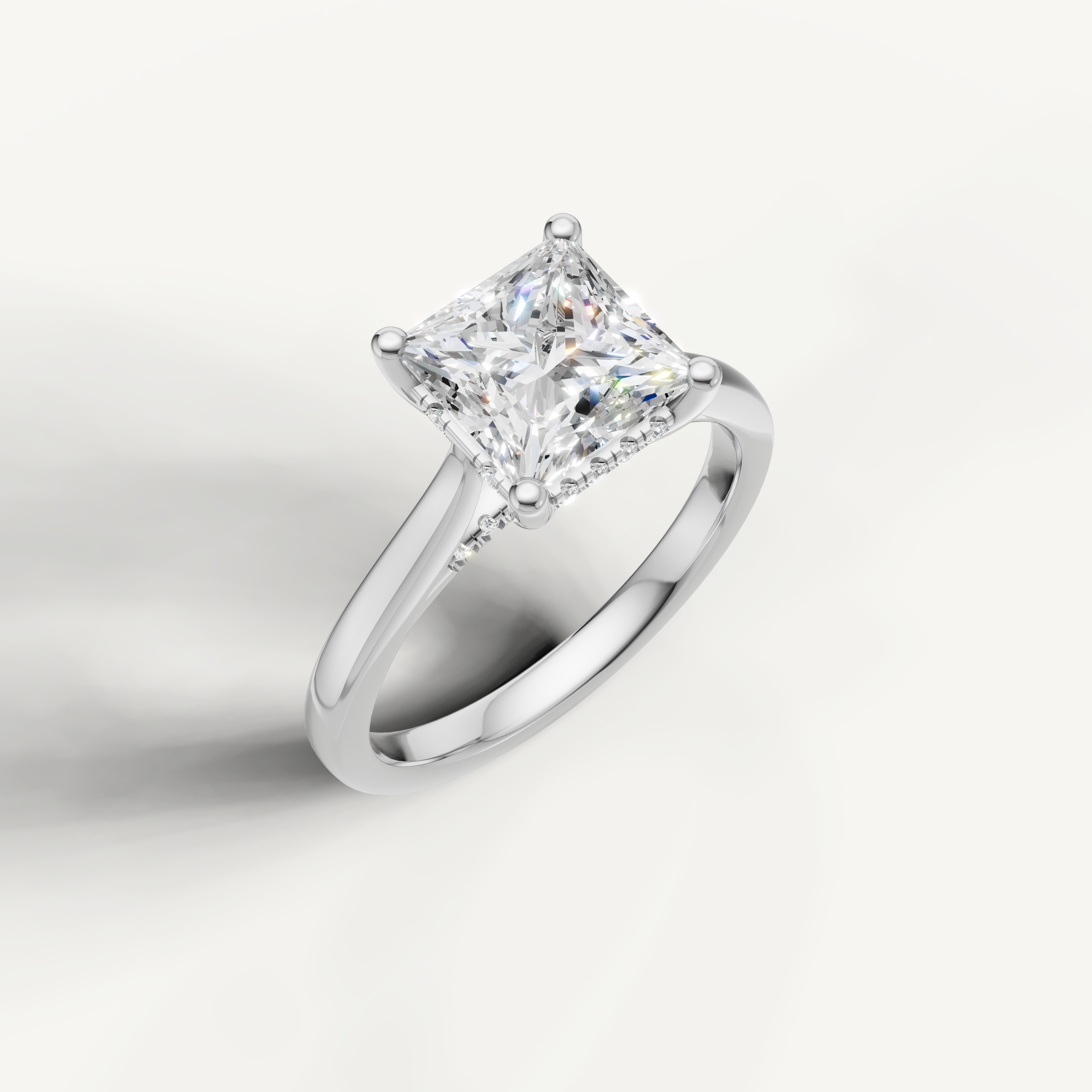 White gold princess-cut lab-grown diamond solitaire ring with pavé hidden halo setting