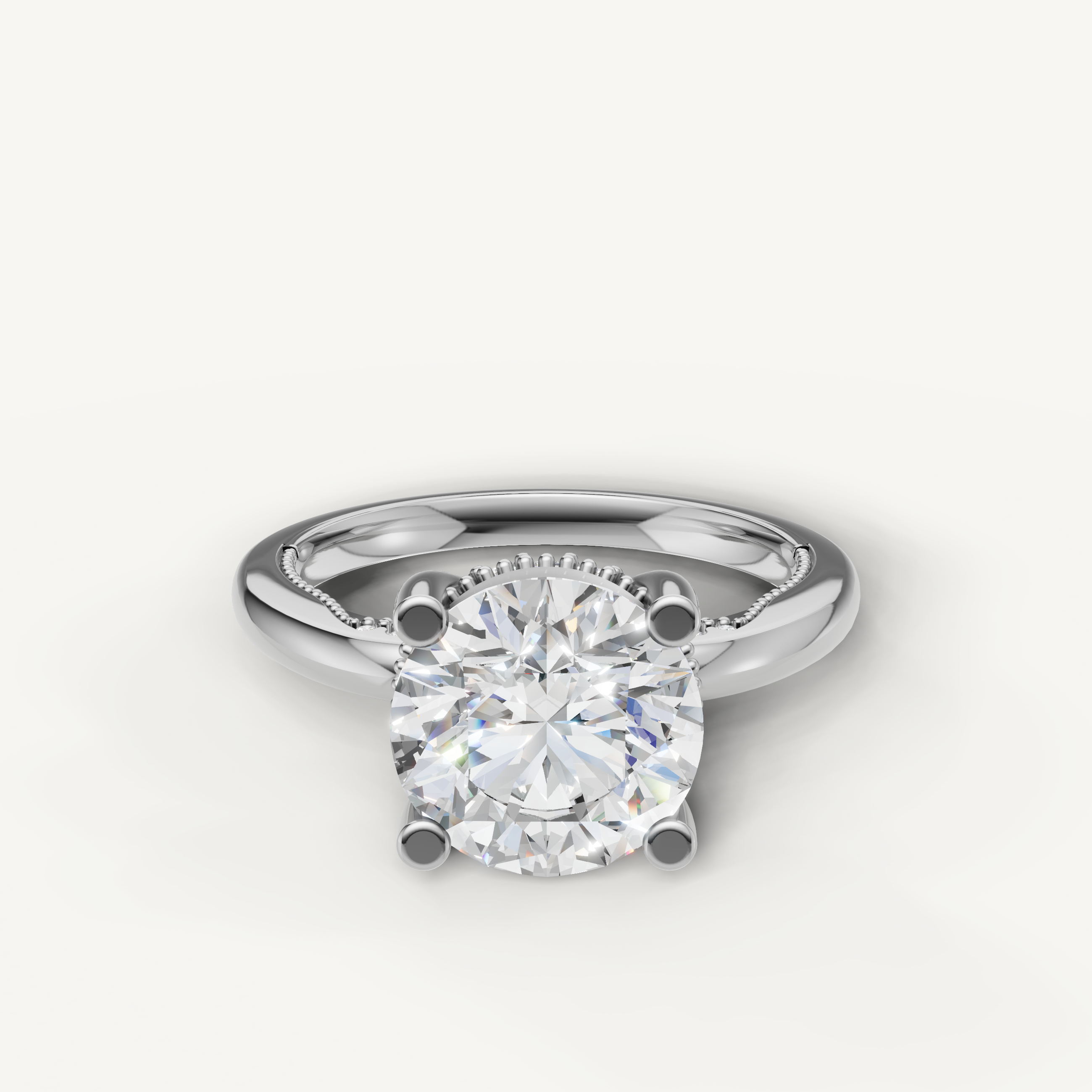 A classic solitaire engagement ring in bright, polished white gold or platinum, featuring a dazzling, high-clarity round brilliant diamond.