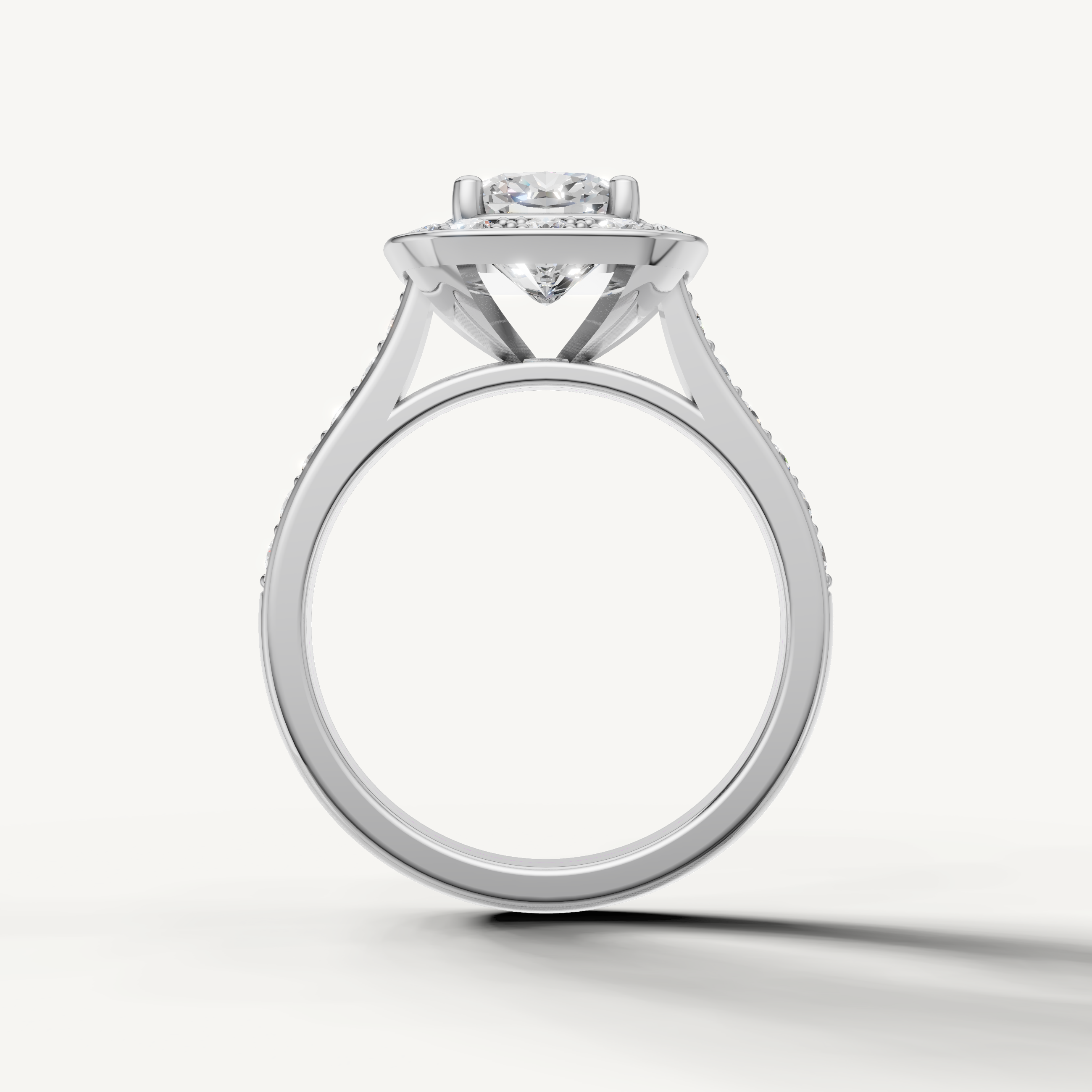 Vintage style white gold cushion halo ring handcrafted by Raul Diamonds.