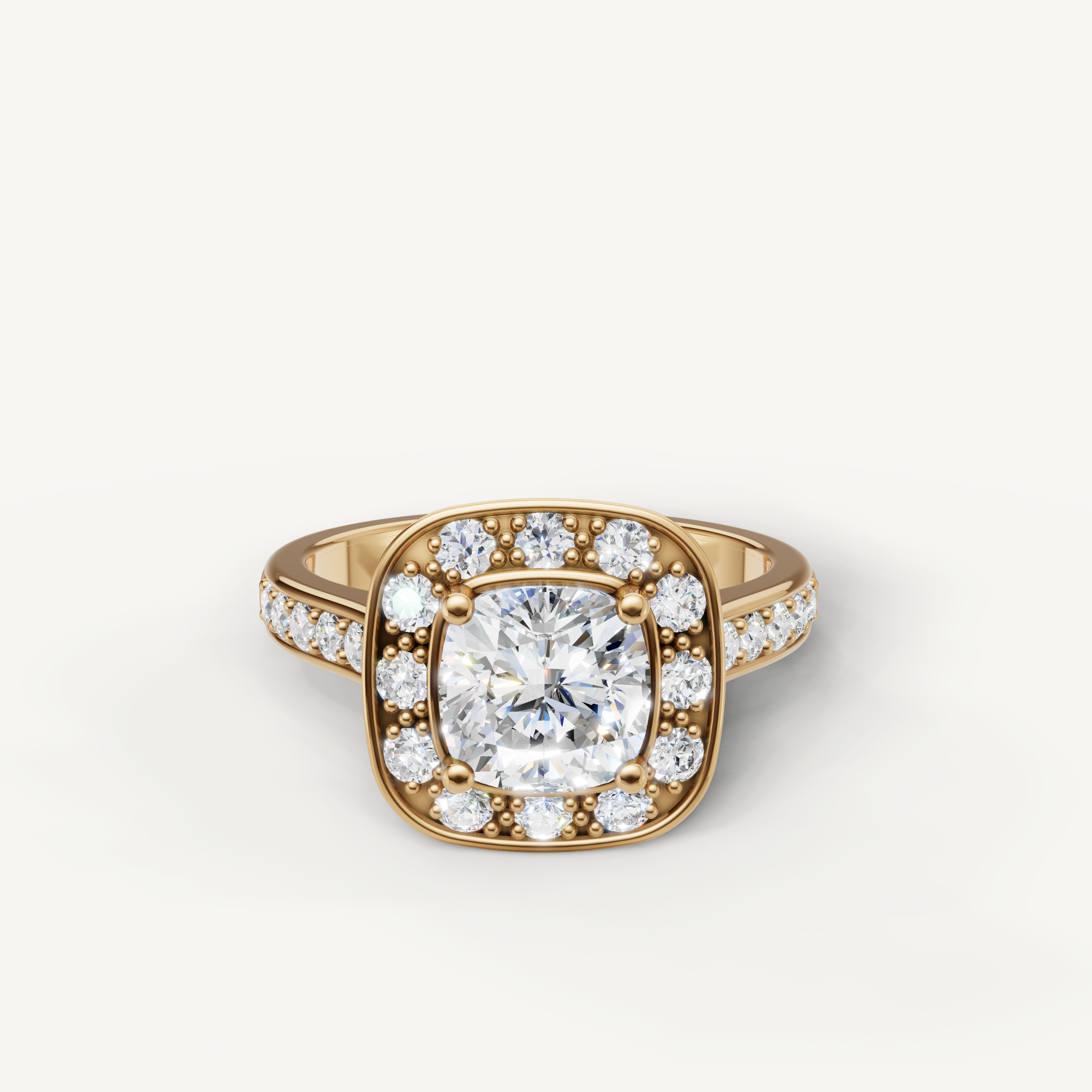 Raul Diamonds yellow gold cushion cut halo ring with round accent diamonds and pave shank.