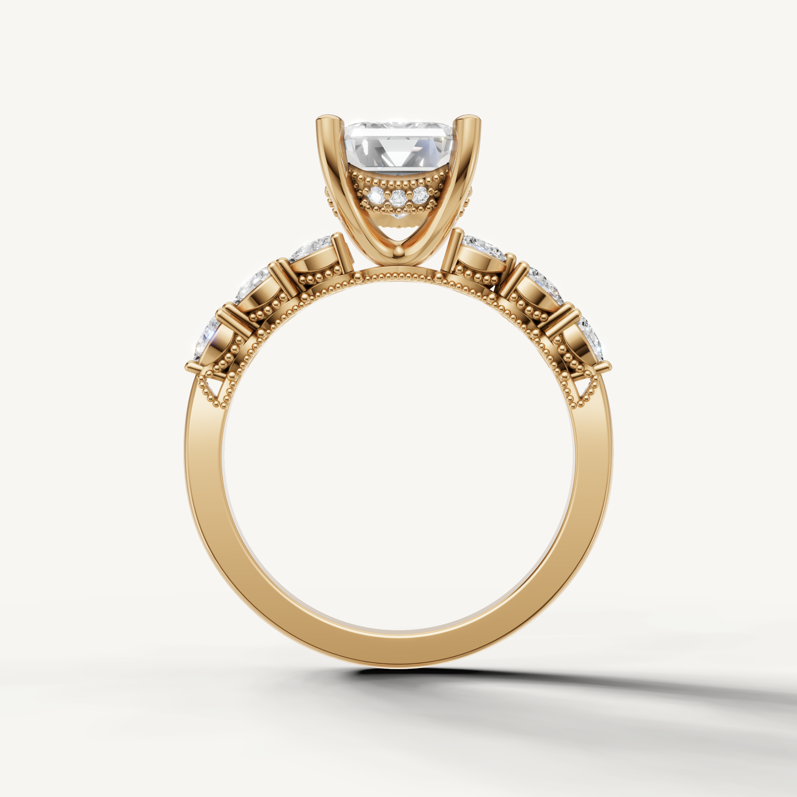 emerald diamond engagement ring with art deco marquise and baguette side stones yellow gold