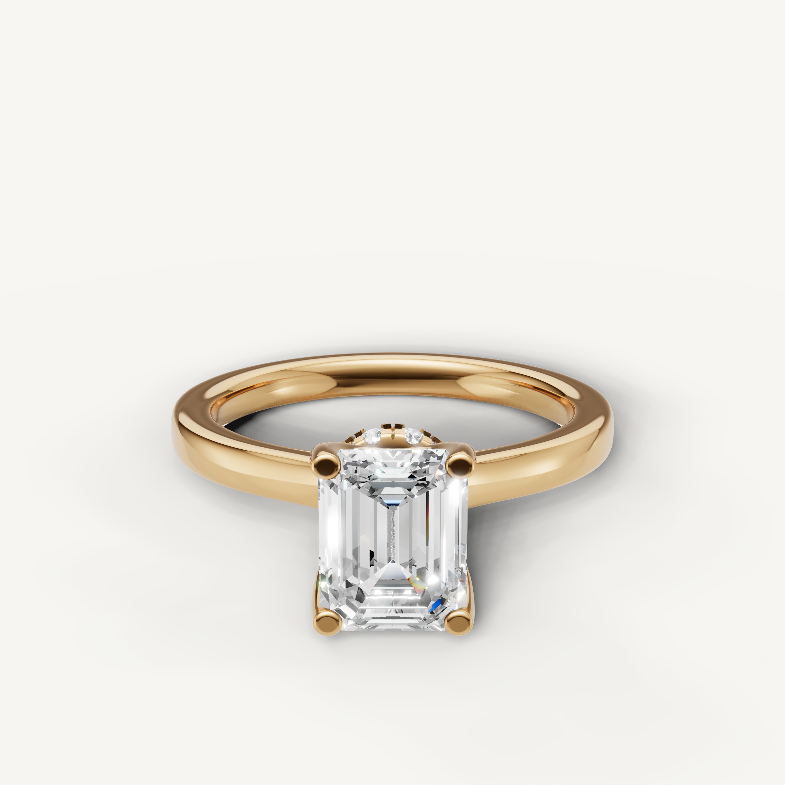 emerald cut lab grown diamond solitaire engagement ring in 14k yellow gold with hidden halo detail
