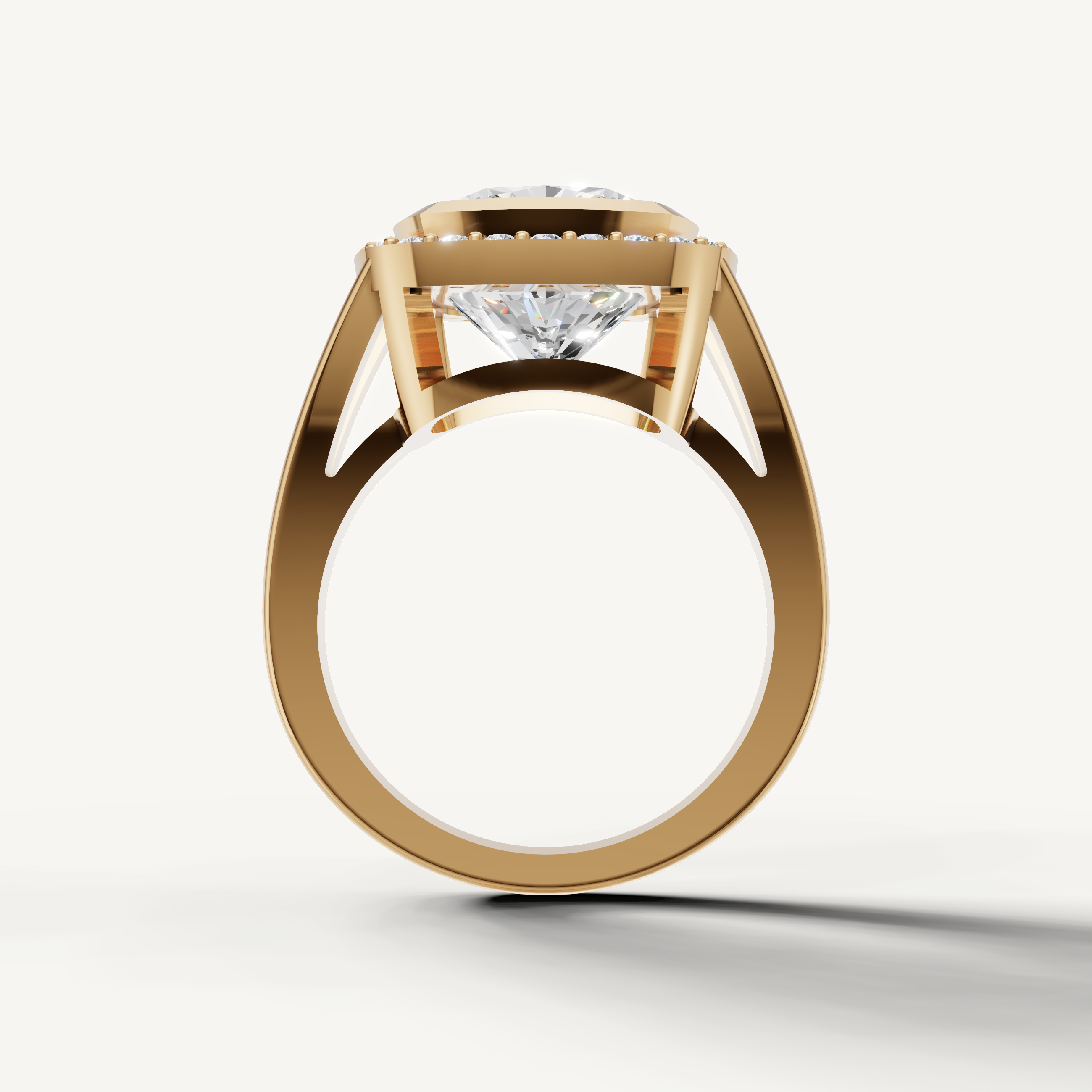Elegant pear diamond engagement ring in yellow gold with modern halo design.