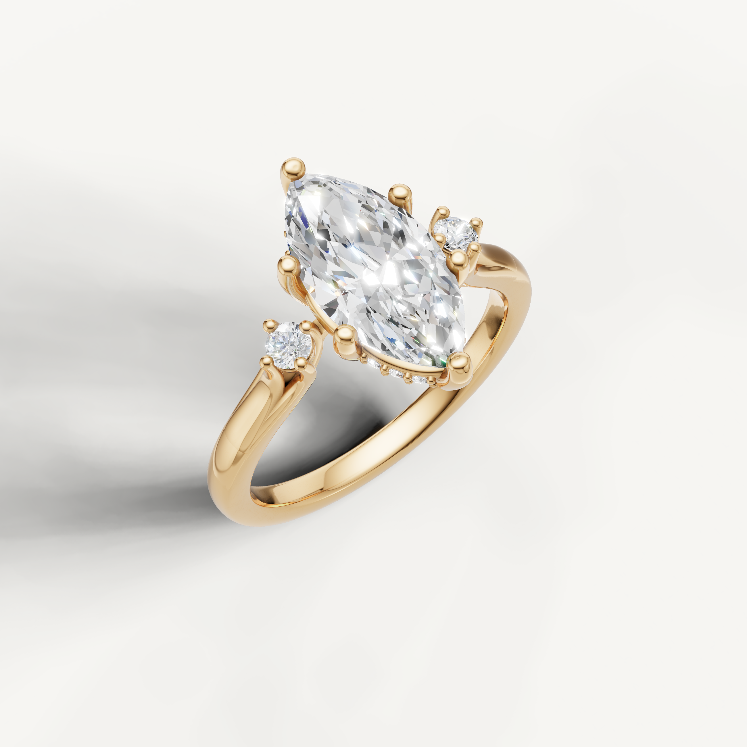 Elegant yellow gold marquise cut diamond ring with elongated navette silhouette and brilliant sparkle