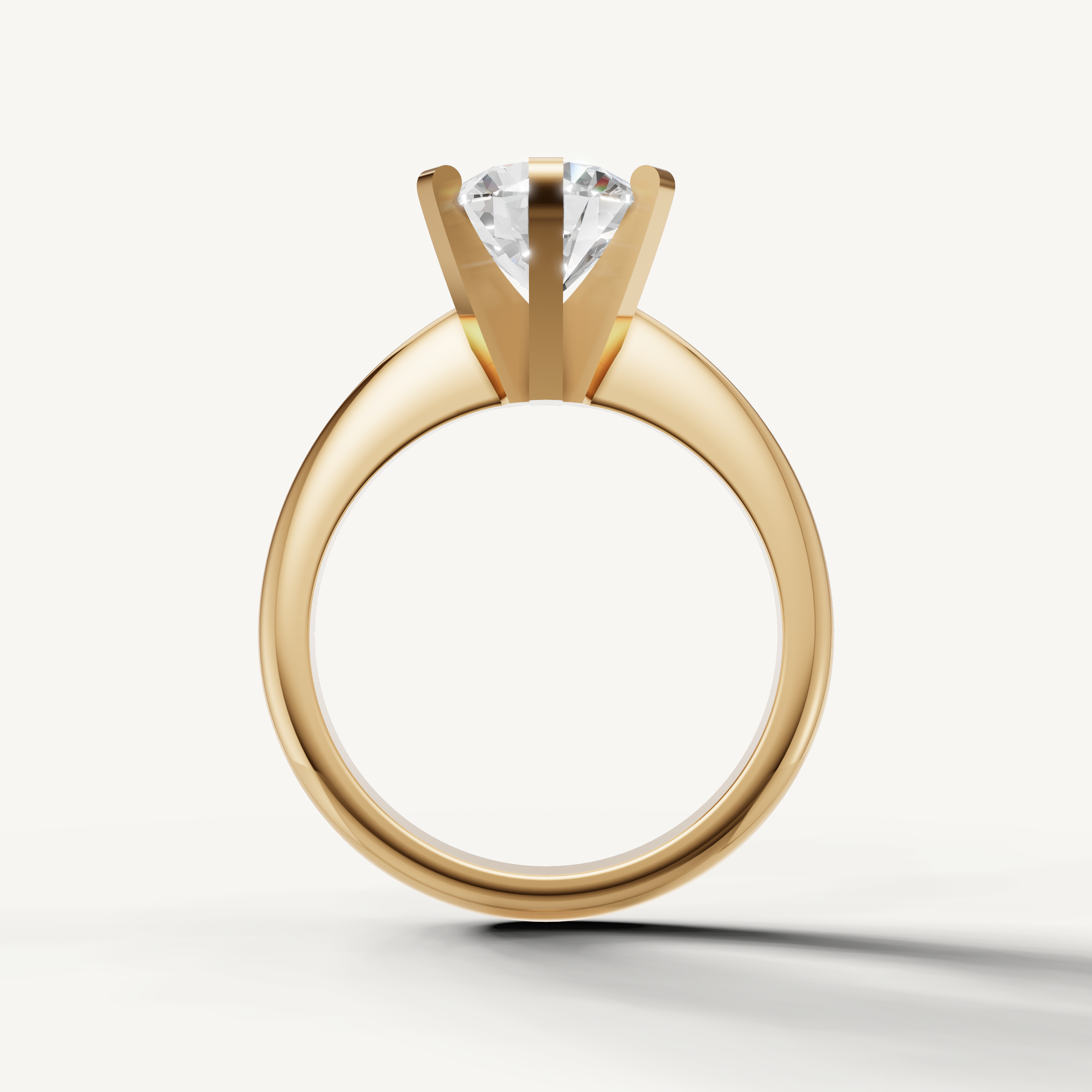 Minimal round diamond ring by Raul Diamonds in polished yellow gold.