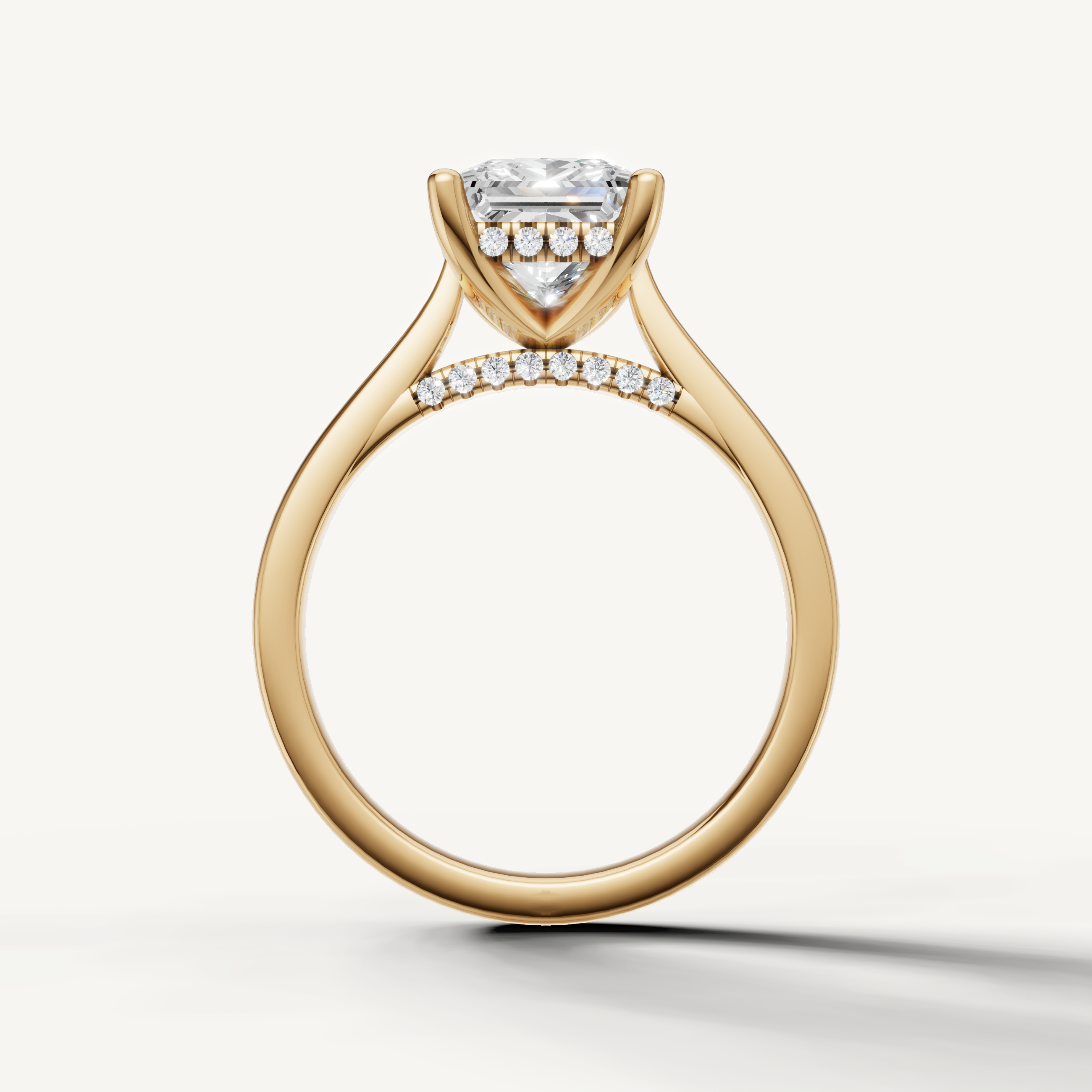 Elegant yellow gold princess-shaped lab-grown diamond ring with hidden pavé halo