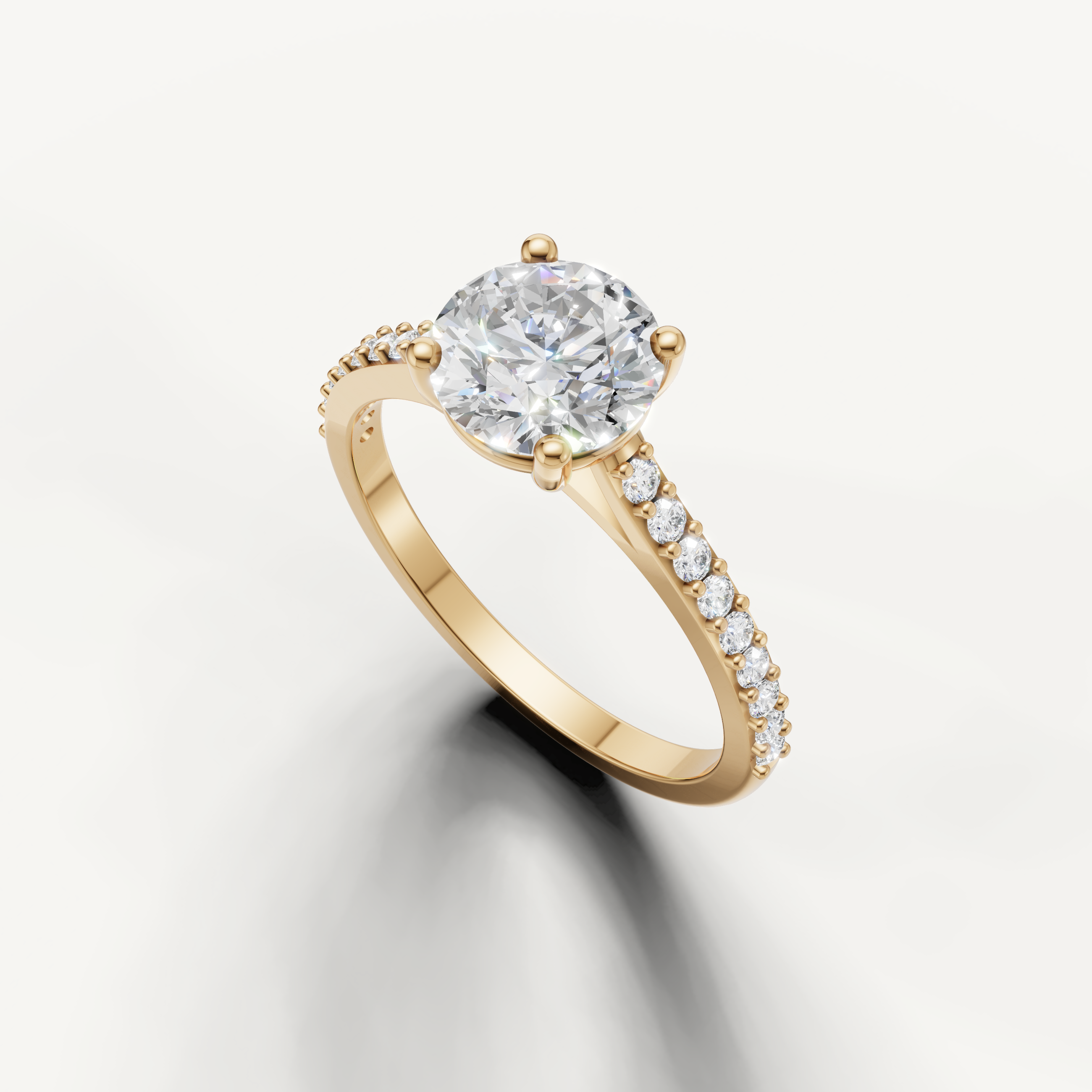 Luxury yellow gold round diamond engagement ring with delicate pavé detailing.