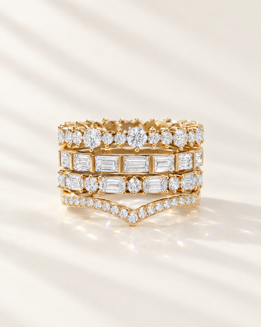 A stack of diamond wedding bands in gold