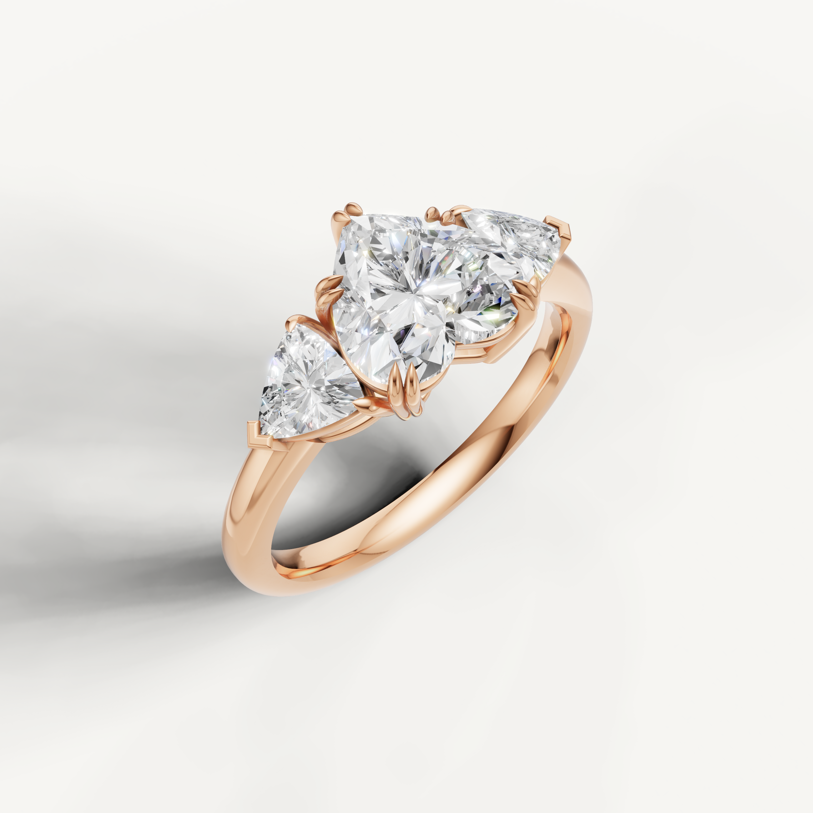 romantic heart shaped lab grown diamond trilogy ring with tapered trillion side diamonds