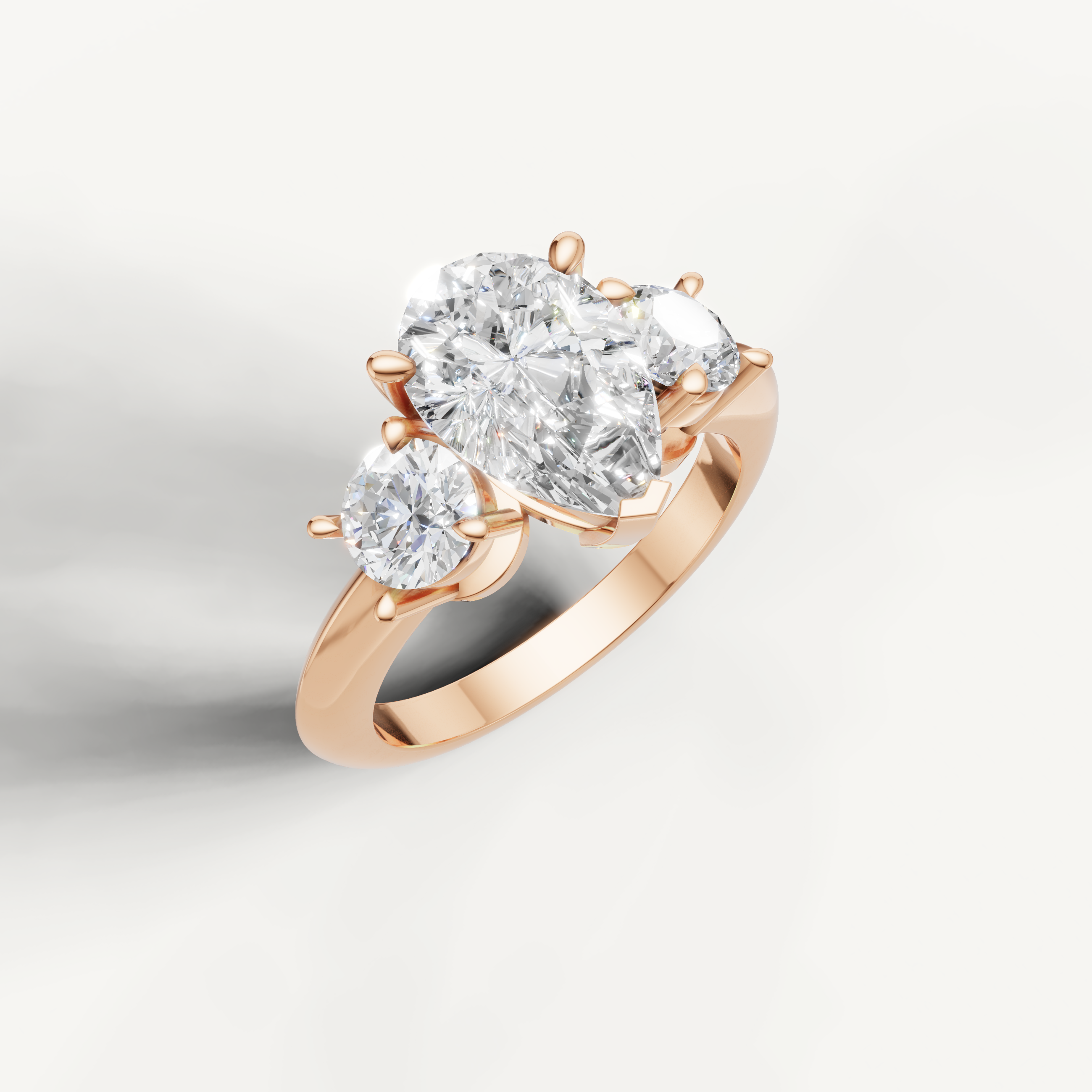 IGI certified pear lab diamond ring with round side stones rose gold DEF VVS