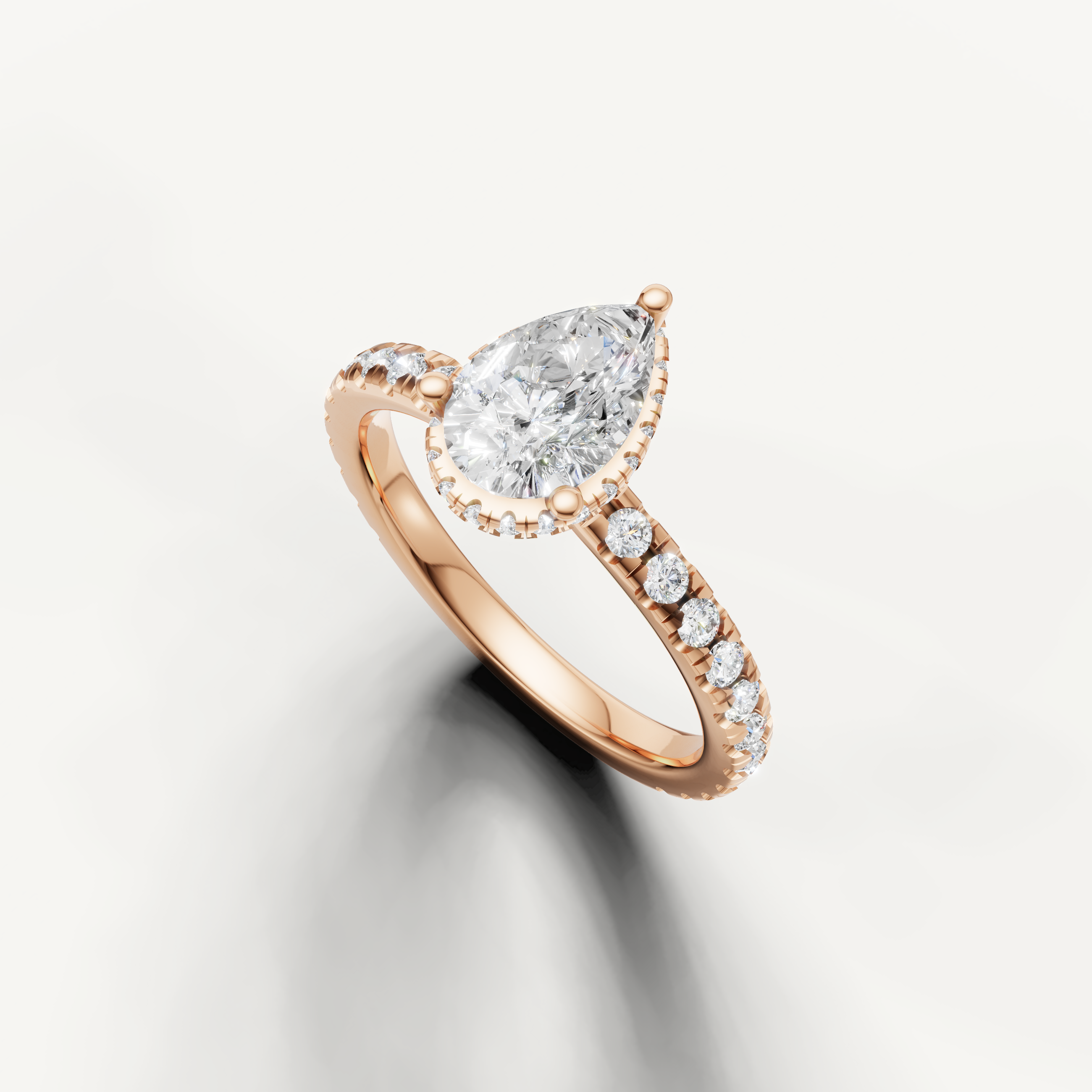 14k rose gold pear cut lab grown diamond engagement ring with hidden halo sparkle and fine pavé band