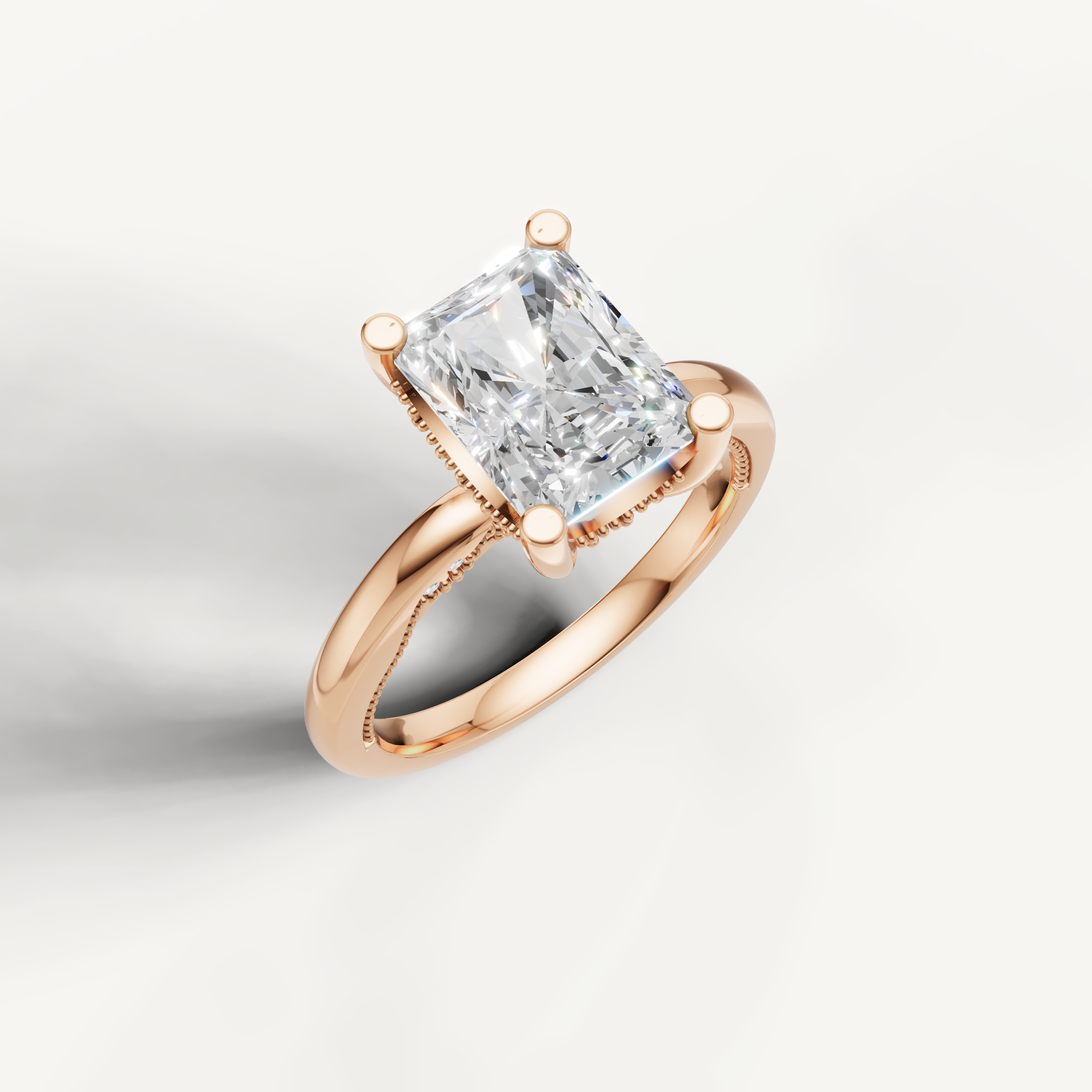 A soft rose gold solitaire ring highlighting the elegant, elongated shape of an oval-cut center stone.