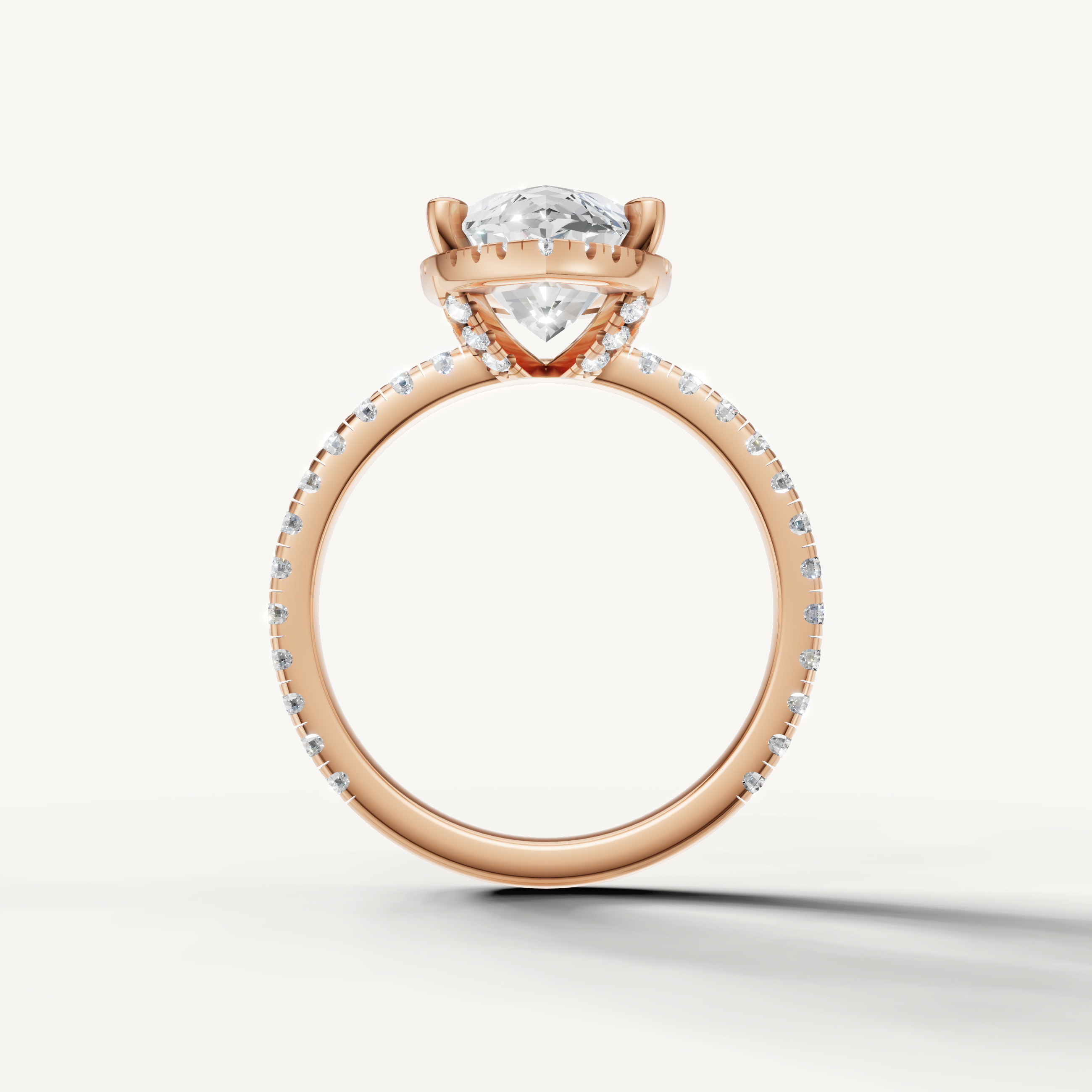 Marquise shape engagement ring with pavé band and hidden halo rose gold romantic style