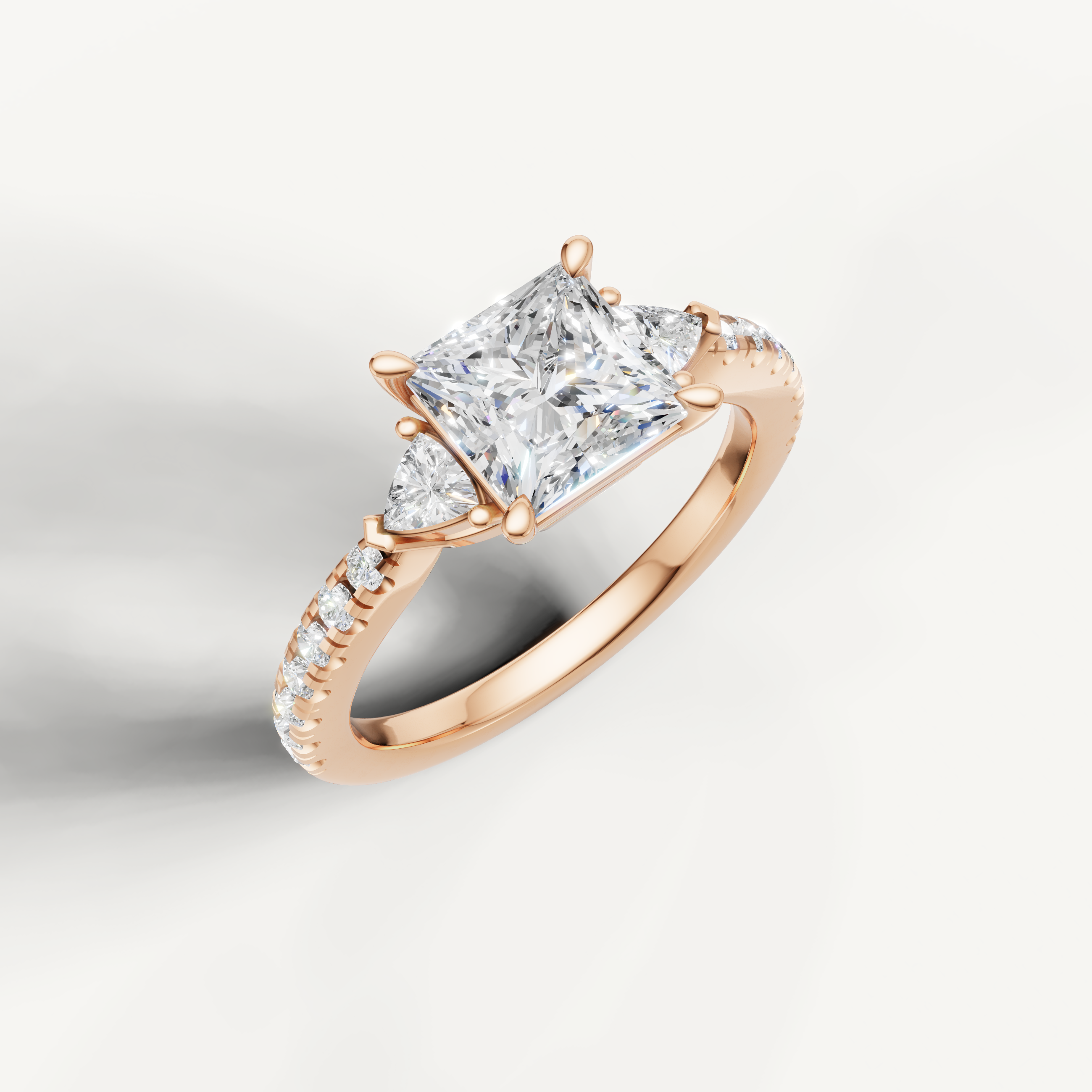 14K rose gold princess cut lab grown diamond ring with tapered side diamonds and pavé setting
