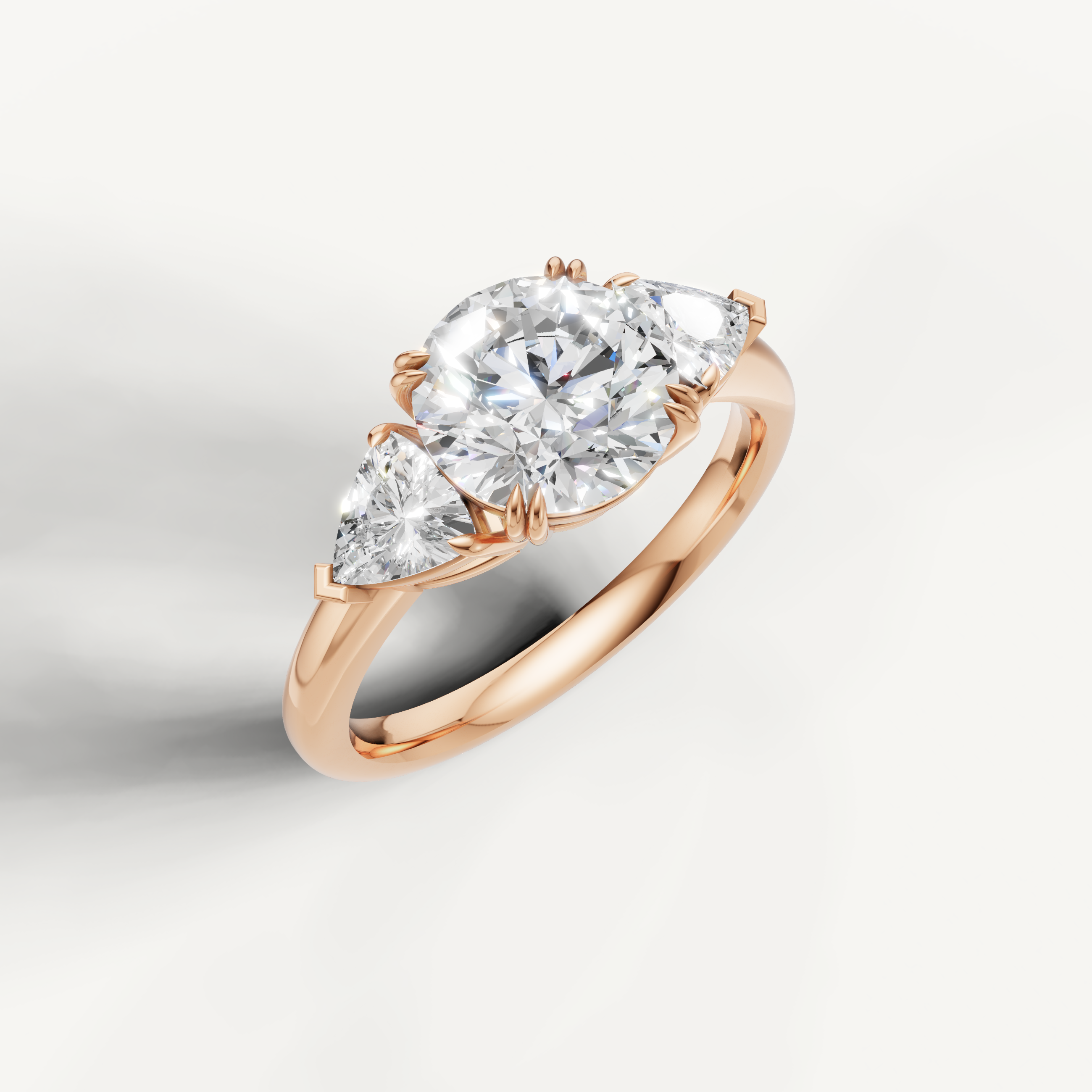 romantic round cut lab grown diamond trilogy ring with tapered trillion side diamonds