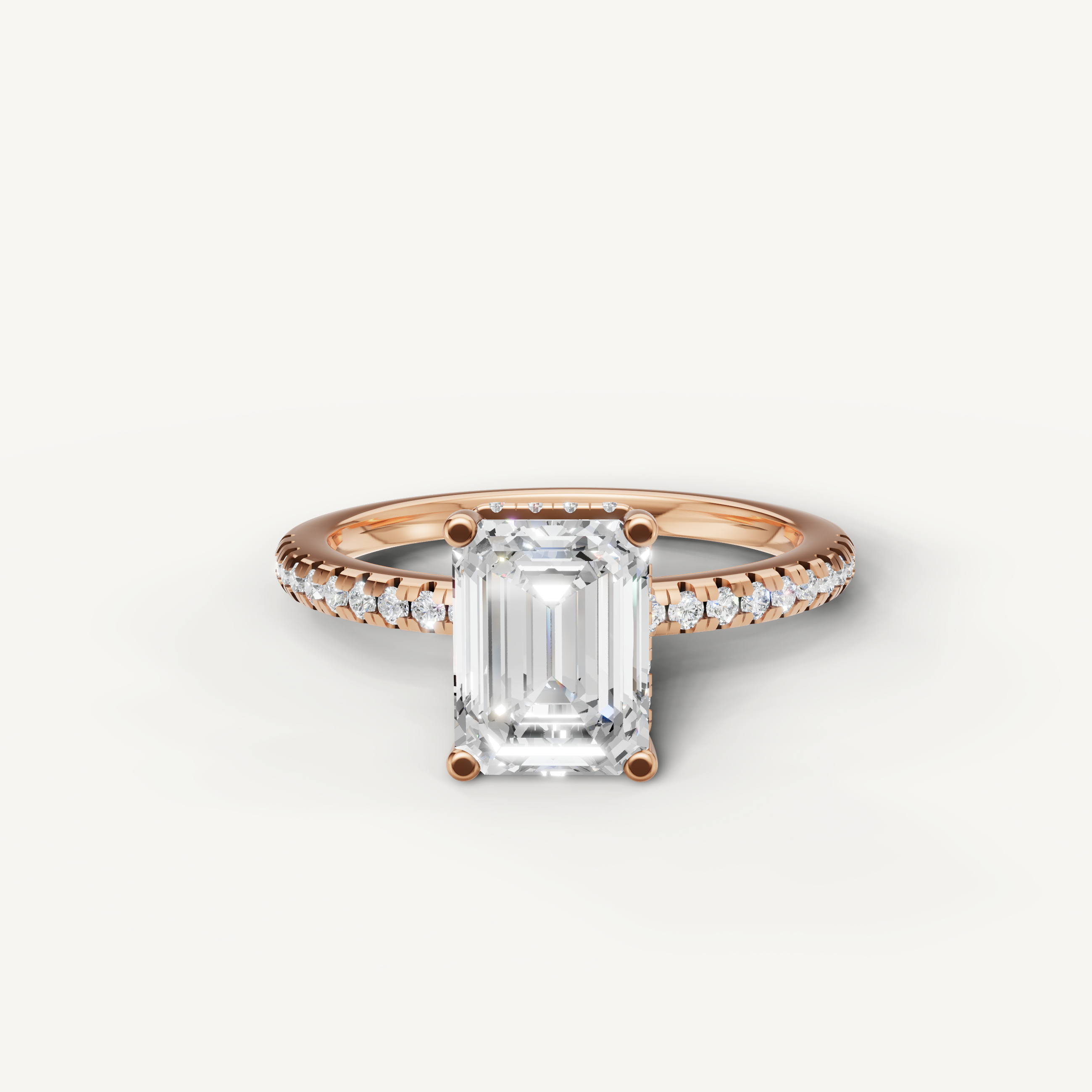 emerald cut lab grown diamond engagement ring with pavé band in 14k rose gold