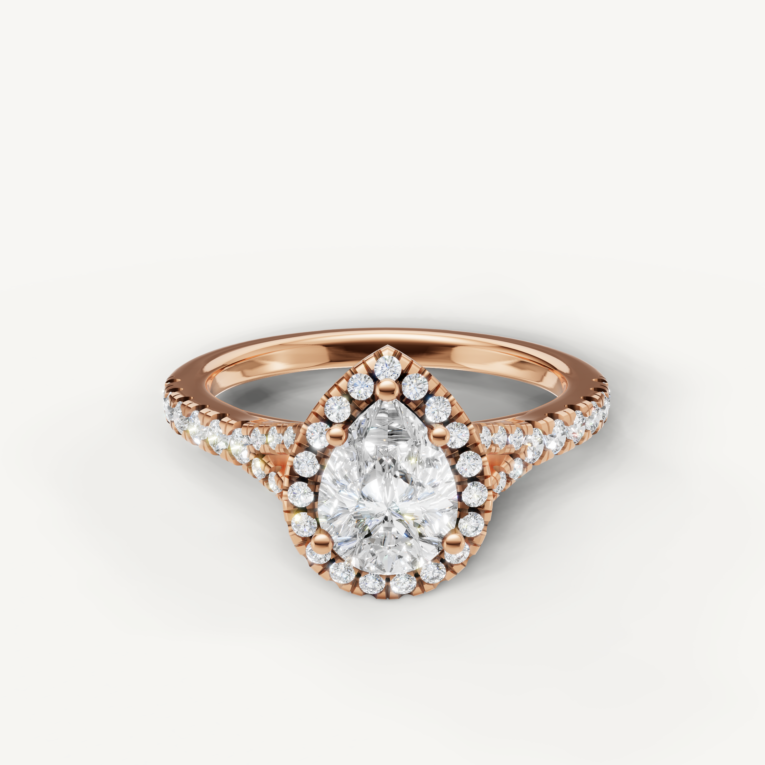 Pear cut halo pavé lab grown diamond engagement ring in 14K rose gold