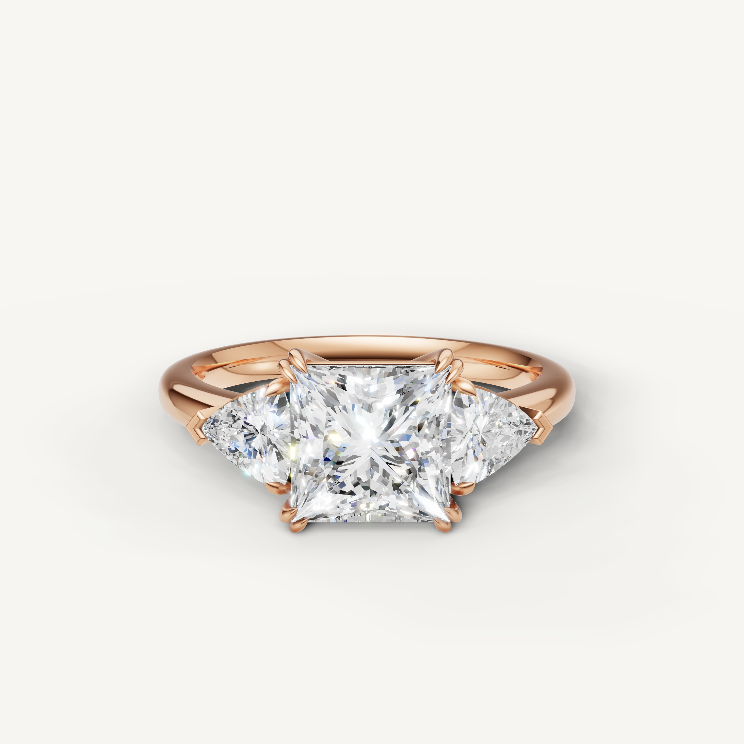 princess cut lab grown diamond engagement ring with trillion side stones in 14k rose gold