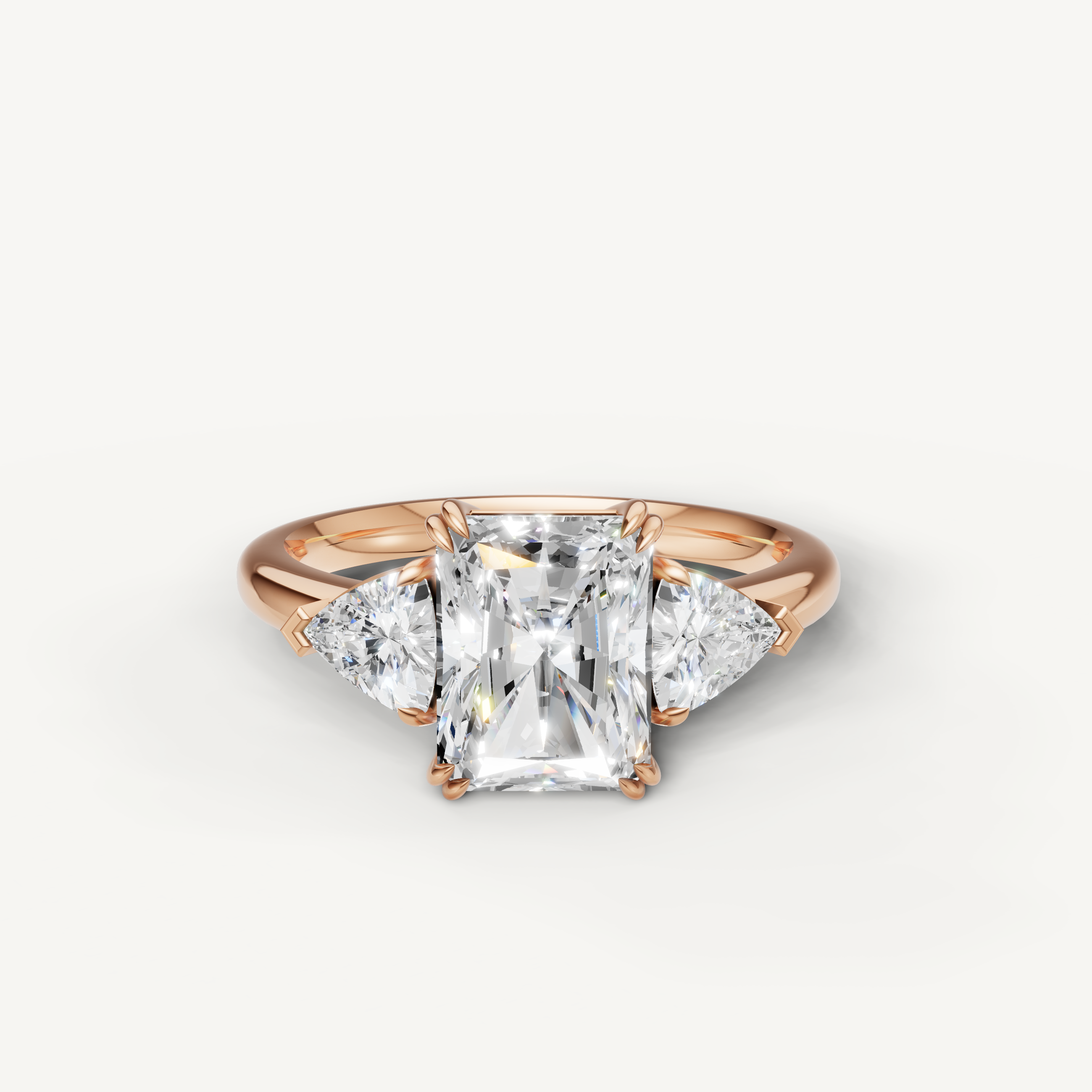 radiant cut lab grown diamond engagement ring with trillion side stones in 14k rose gold