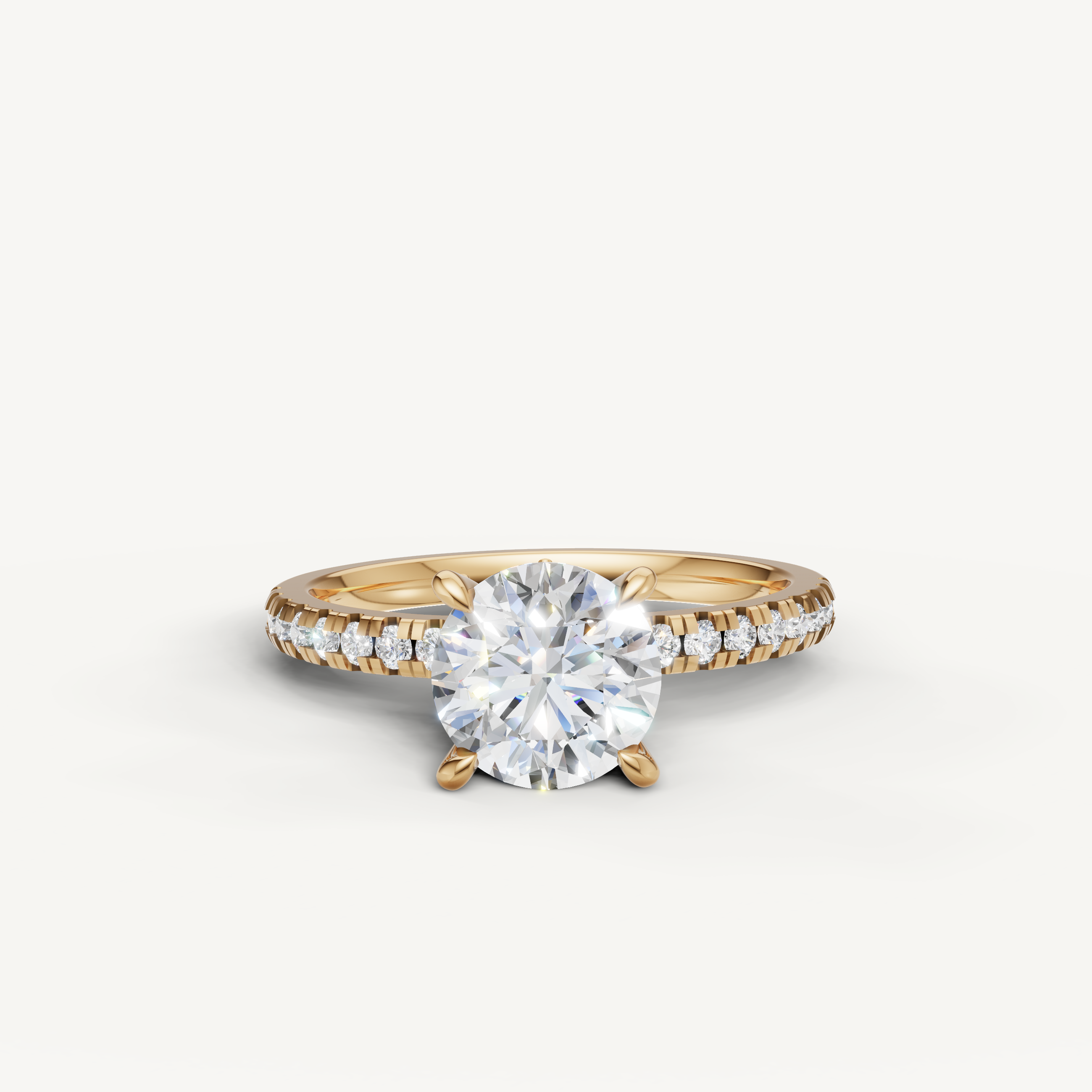 Raul Diamonds round brilliant cut engagement ring in 18k yellow gold with a high-sparkle pavé diamond band.