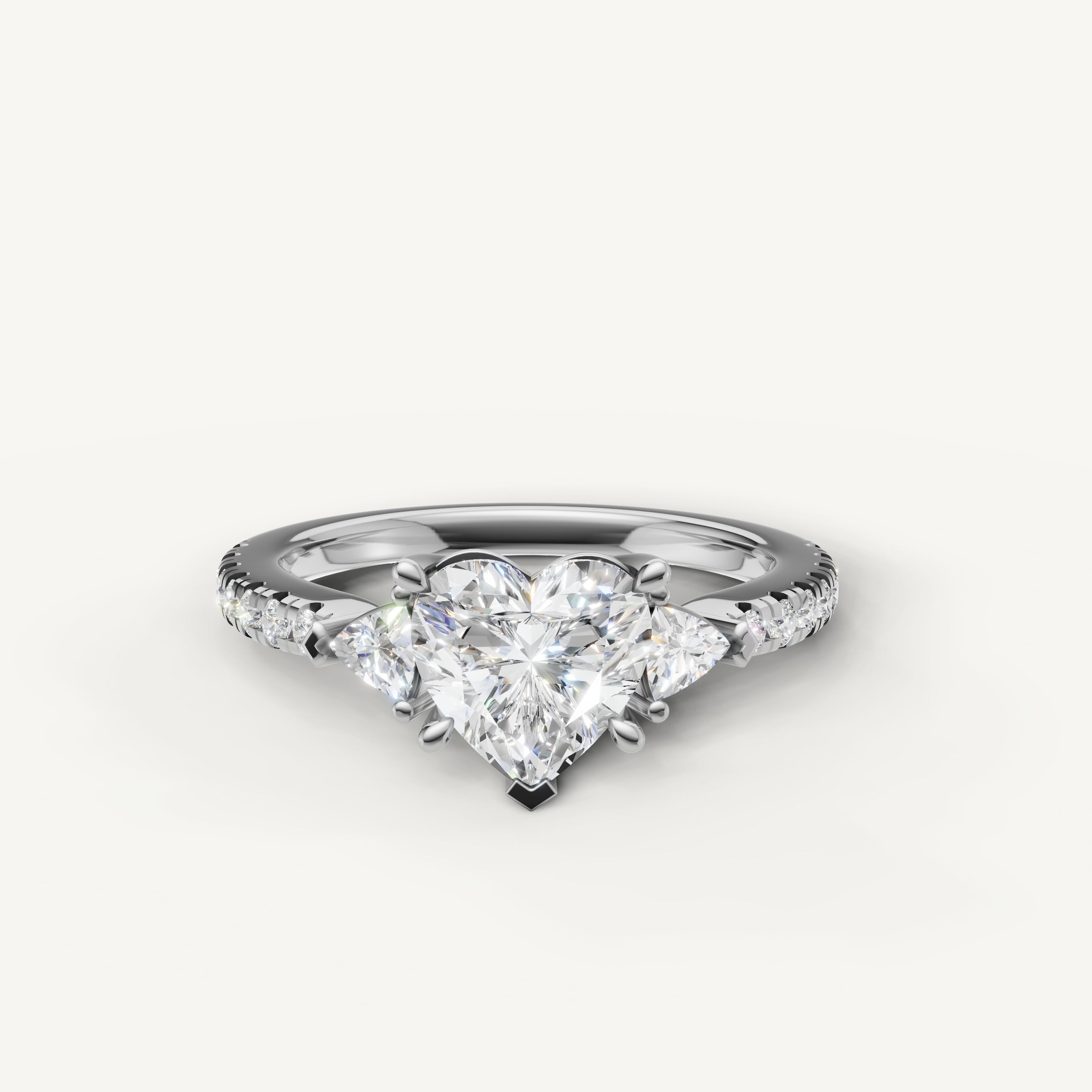 Heart cut lab grown diamond engagement ring in 14K white gold with three stone design