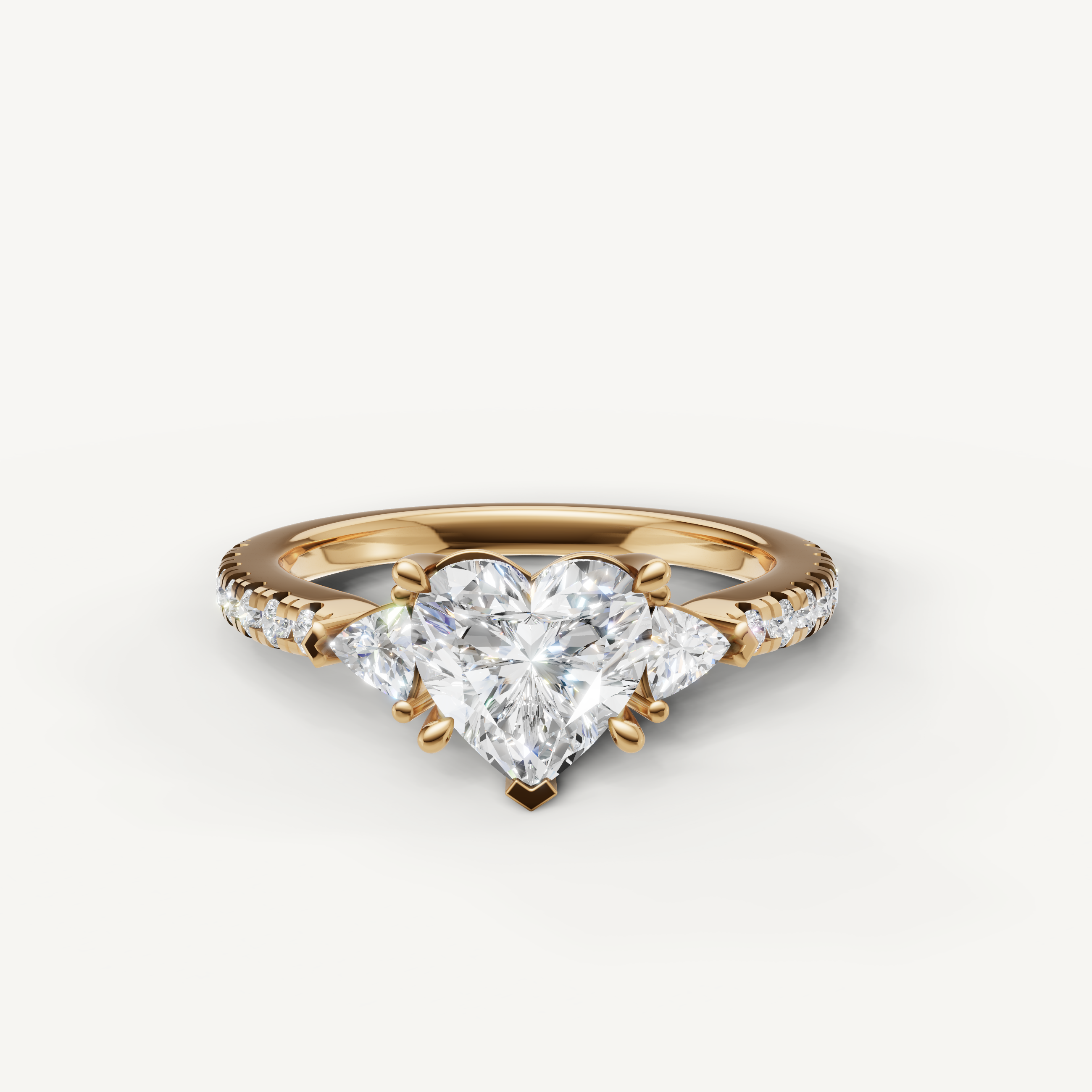 Heart cut lab grown diamond engagement ring in 14K yellow gold with pavé band and side stones