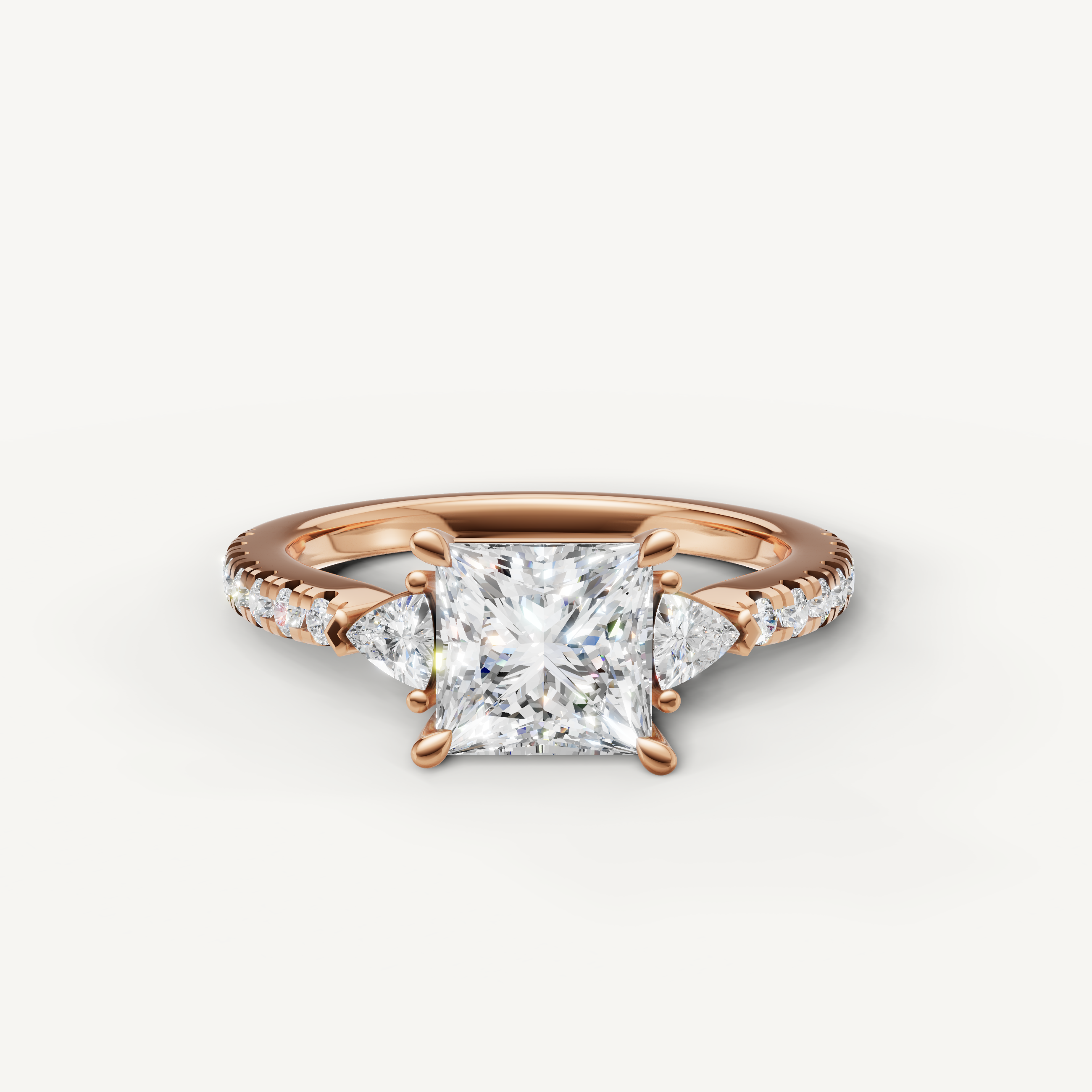Princess cut lab grown diamond engagement ring in 14K rose gold with pavé band and side stones