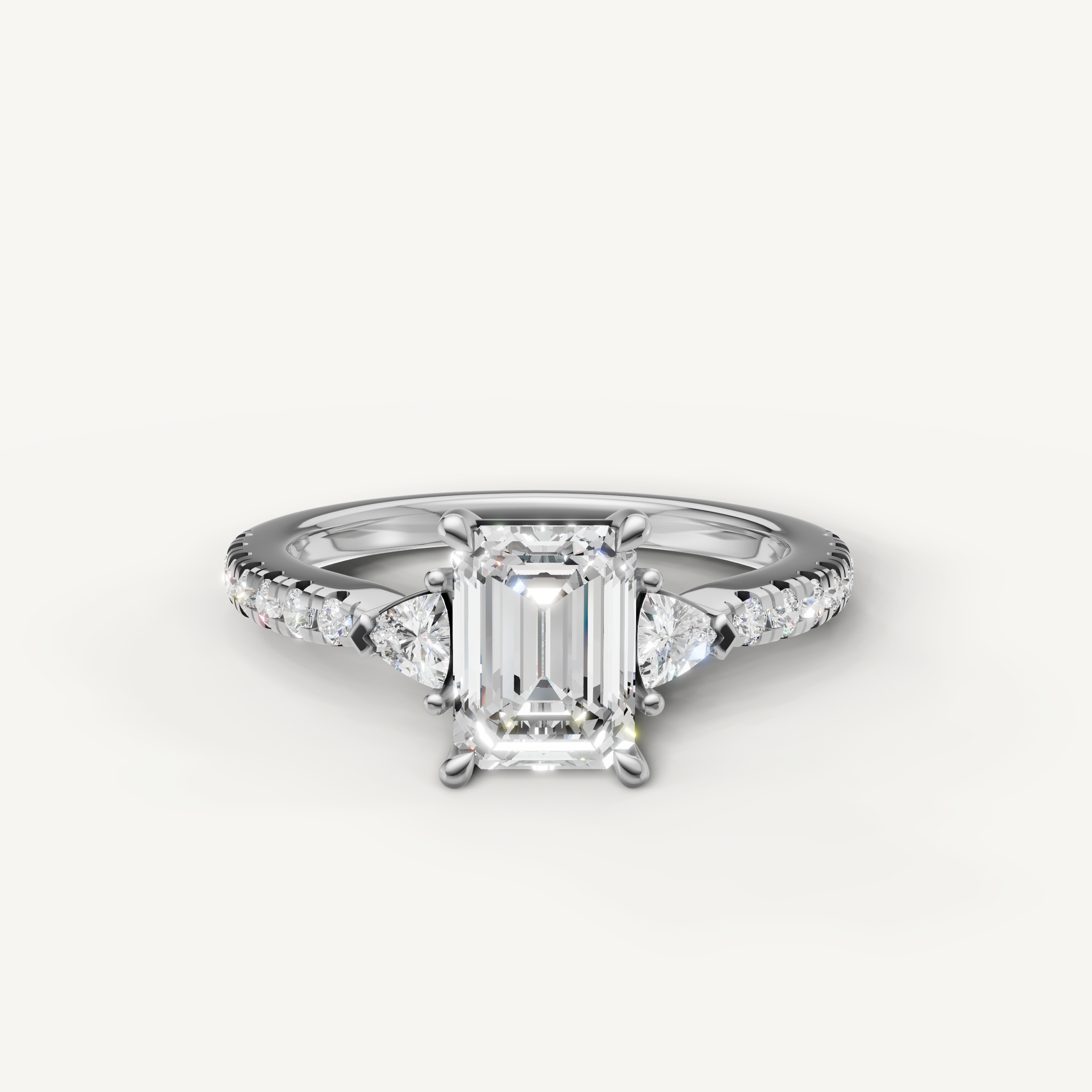 Emerald cut lab grown diamond engagement ring in 14K white gold with three stone design