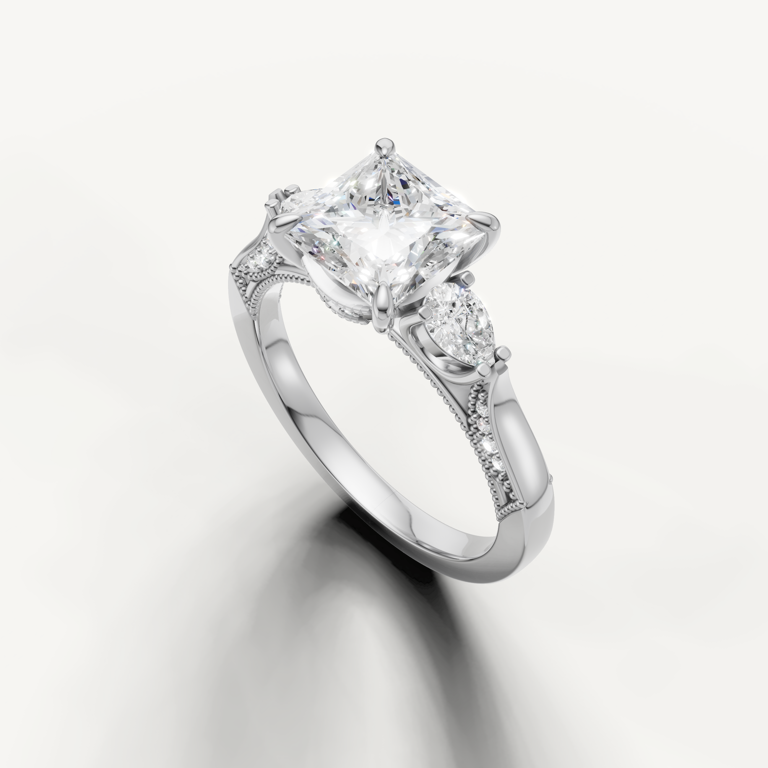 Princess cut solitaire diamond ring with pear side stones white gold elegant design