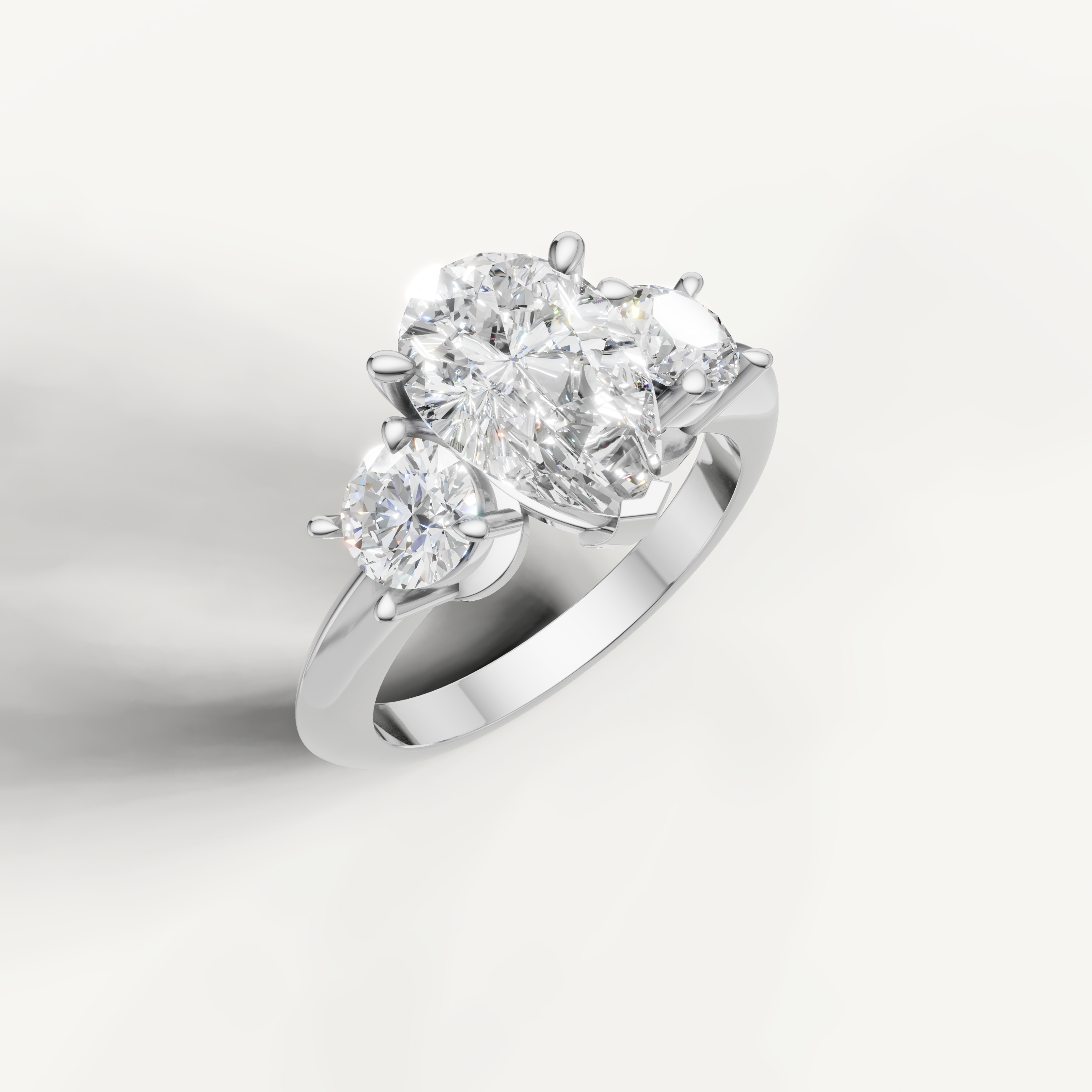 IGI certified pear lab diamond ring with round side stones white gold DEF VVS
