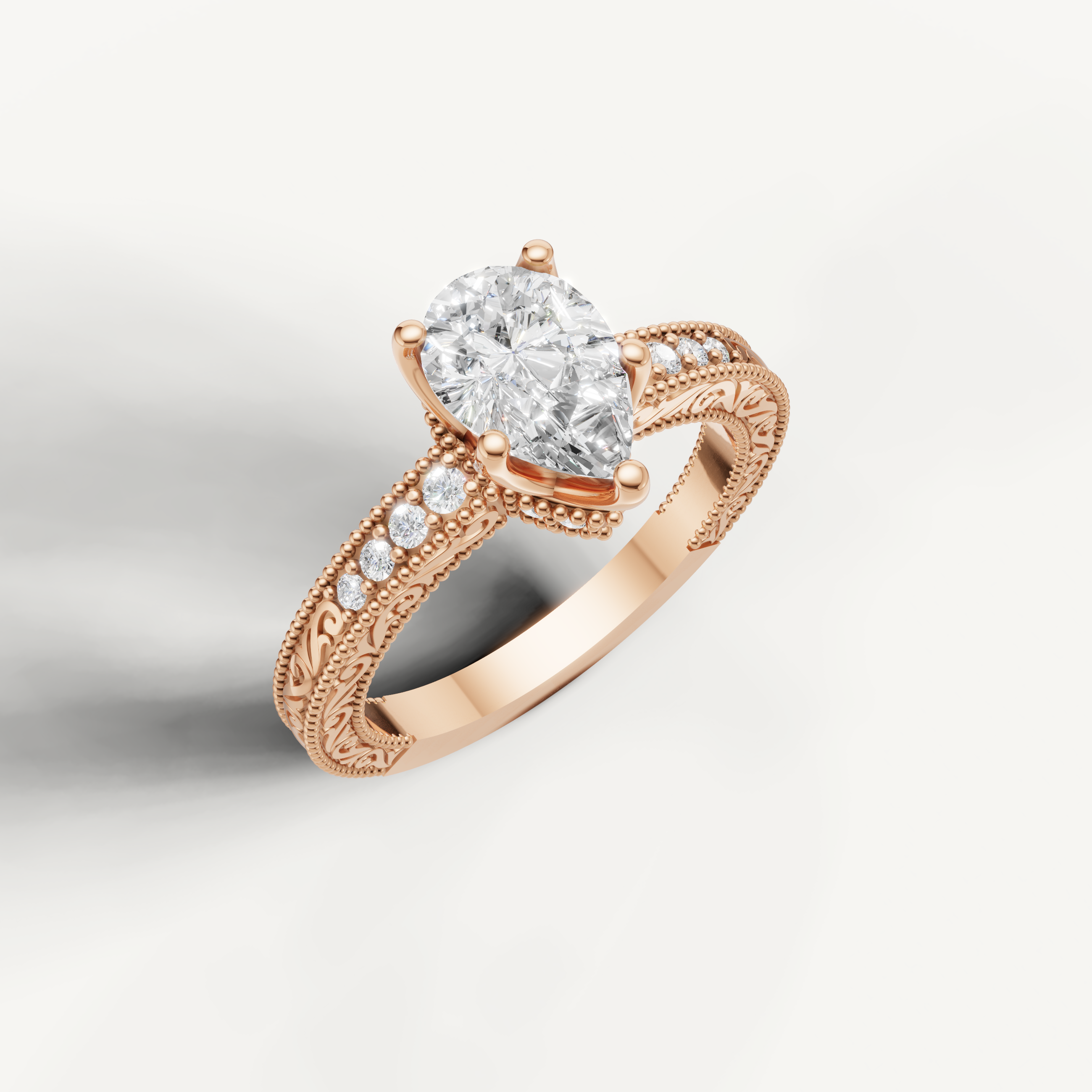 Rose gold pear cut lab grown diamond ring featuring antique-inspired filigree craftsmanship by Raul Diamonds.