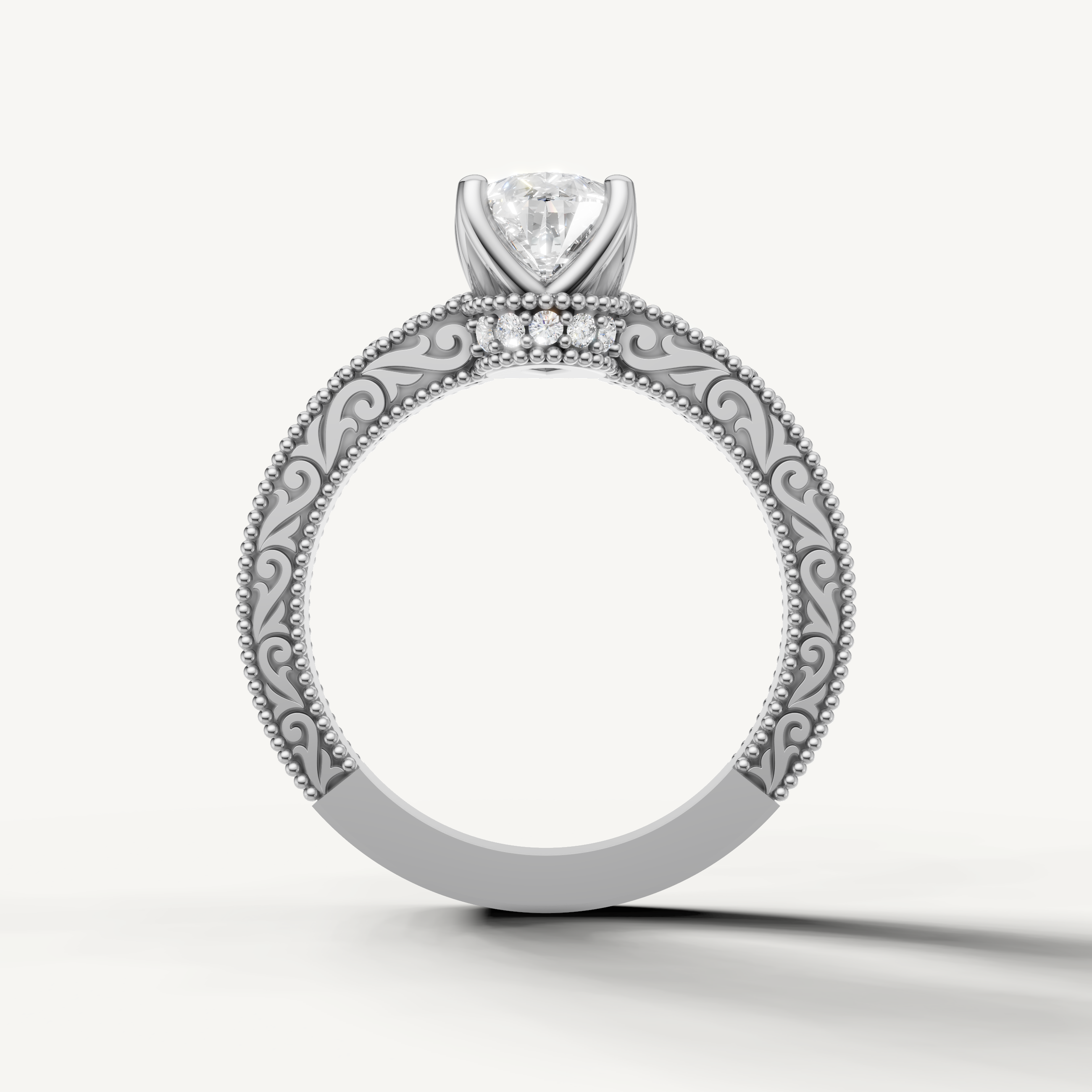Vintage-style pear cut lab grown diamond engagement ring with decorative white gold band and intricate milgrain details by Raul Diamonds.