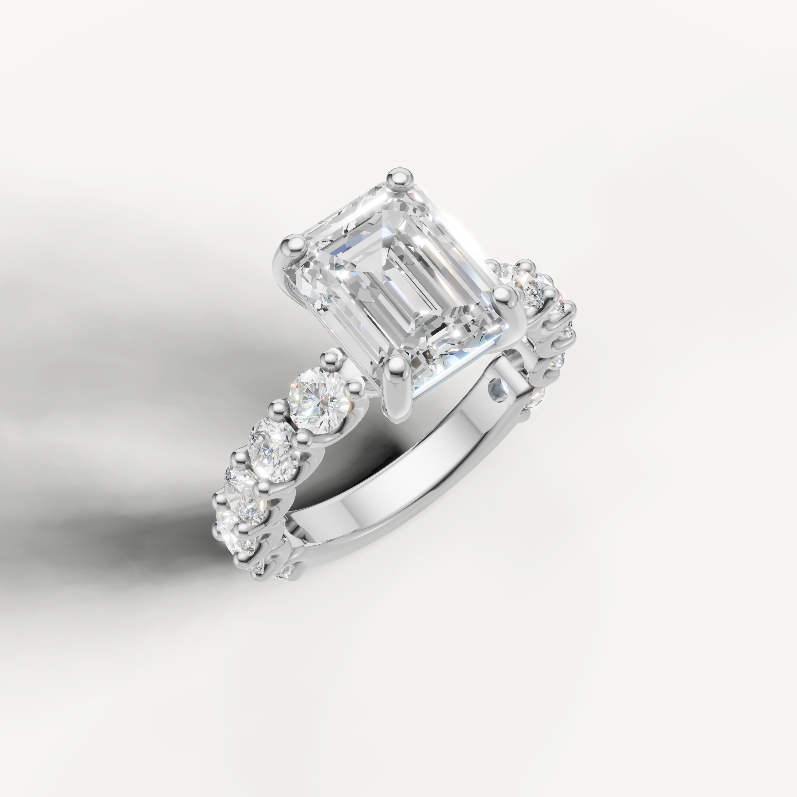 IGI certified emerald lab diamond ring with round side diamonds shared prong band white gold