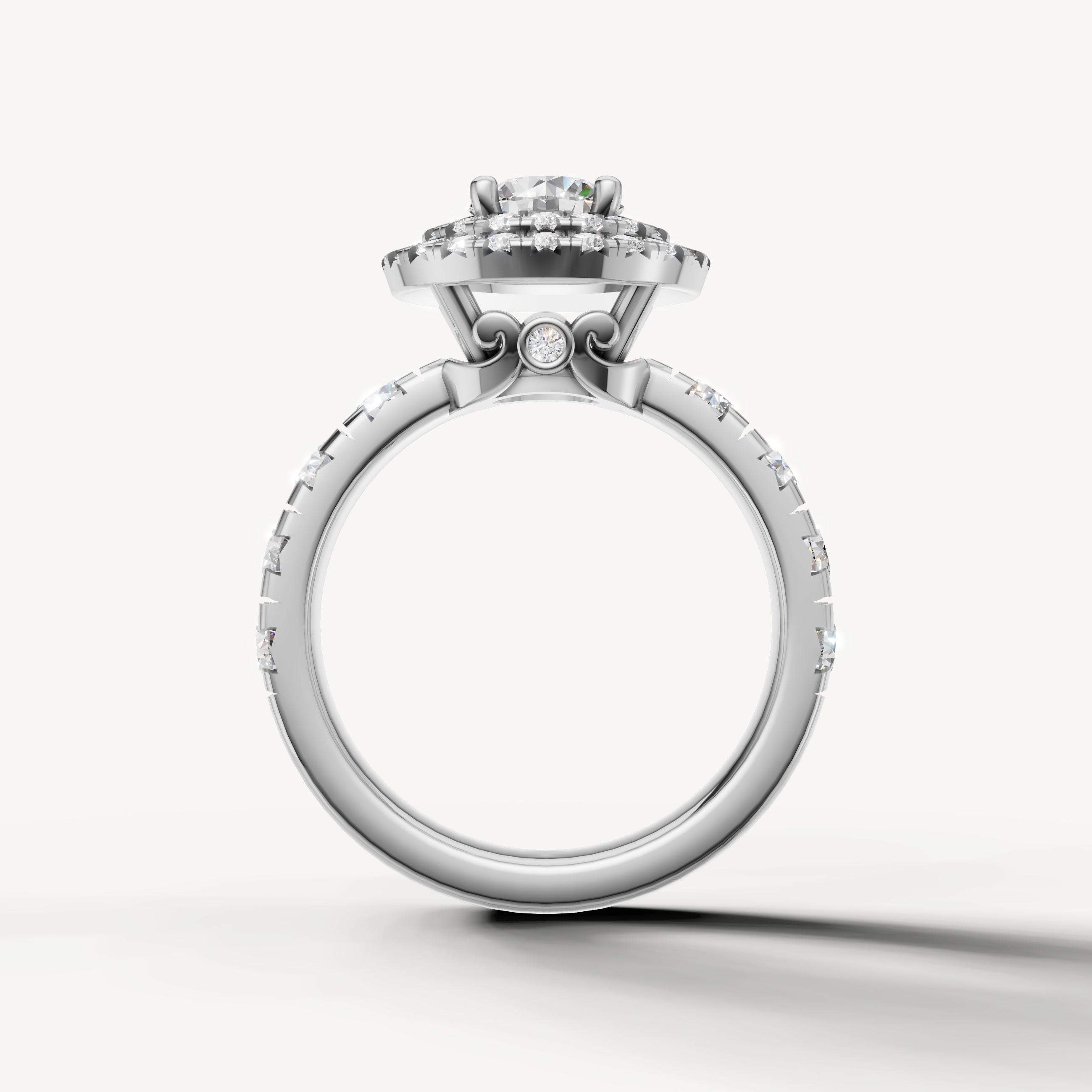 Round center diamond ring with shimmering halo and pavé diamonds from Raul Diamonds