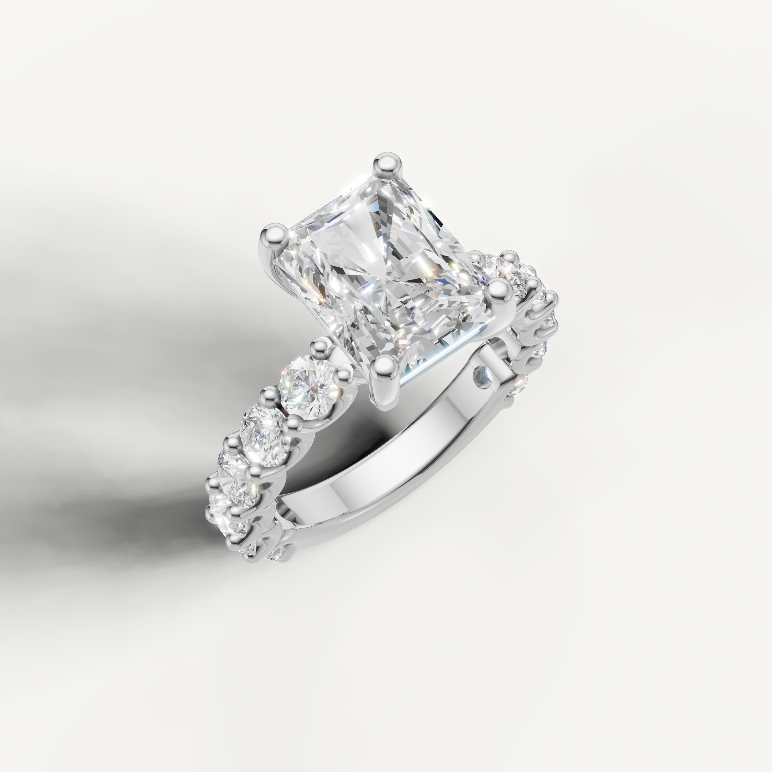 IGI certified radiant cut lab diamond ring profile view with round side stones white gold