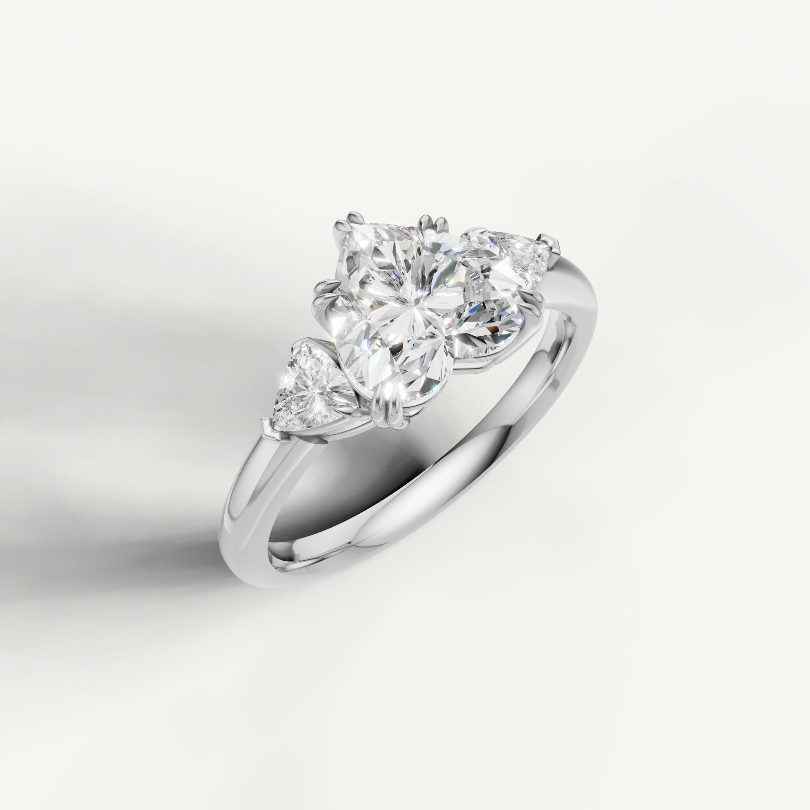 luxurious heart cut lab grown diamond trilogy ring with brilliant trillion side diamonds