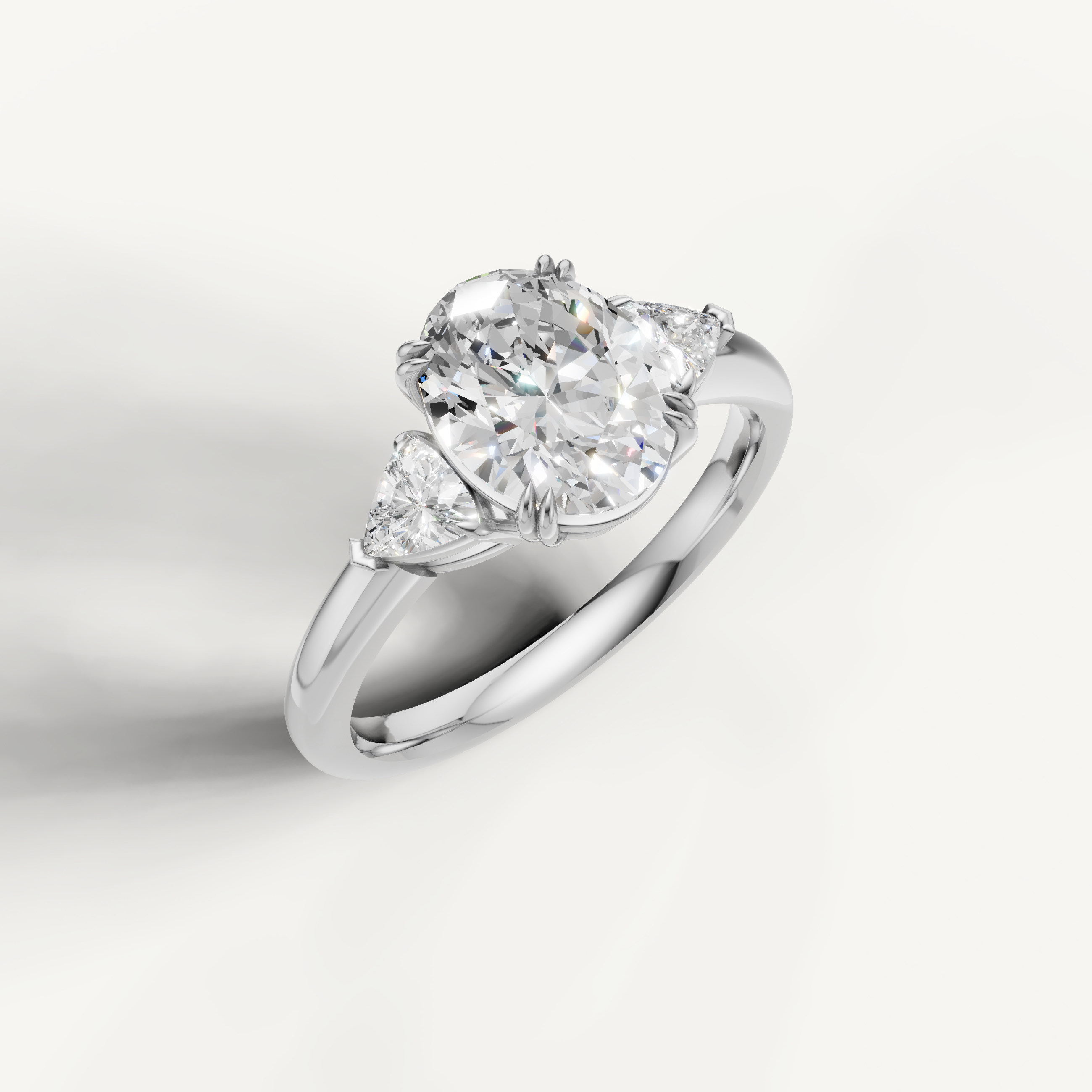 luxurious oval lab grown diamond trilogy ring with brilliant trillion side diamonds