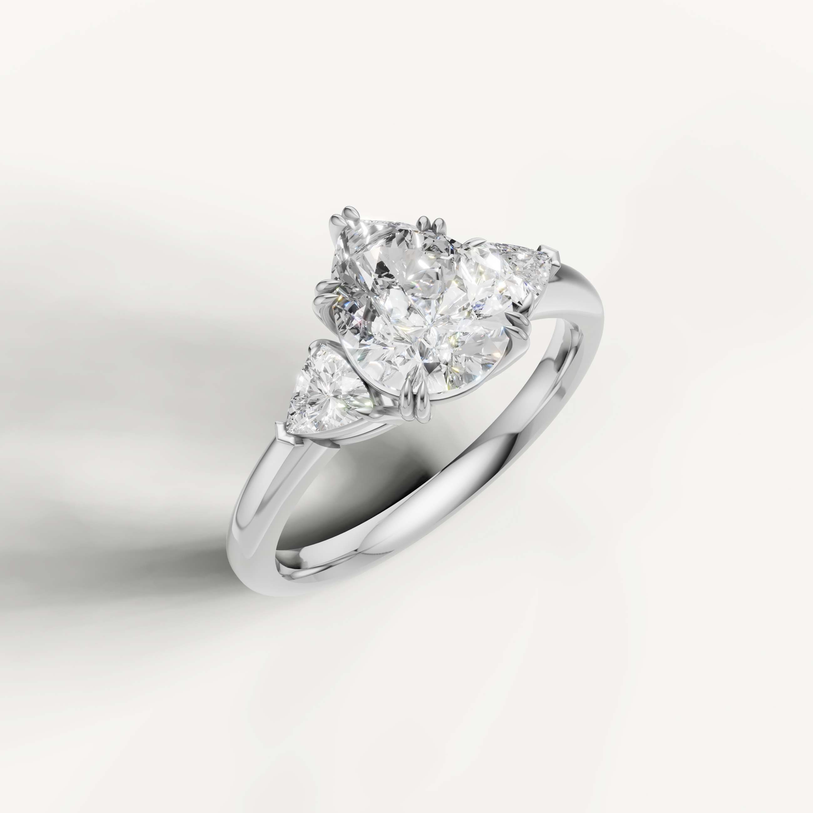 luxurious pear shaped lab grown diamond trilogy ring with brilliant trillion side accents