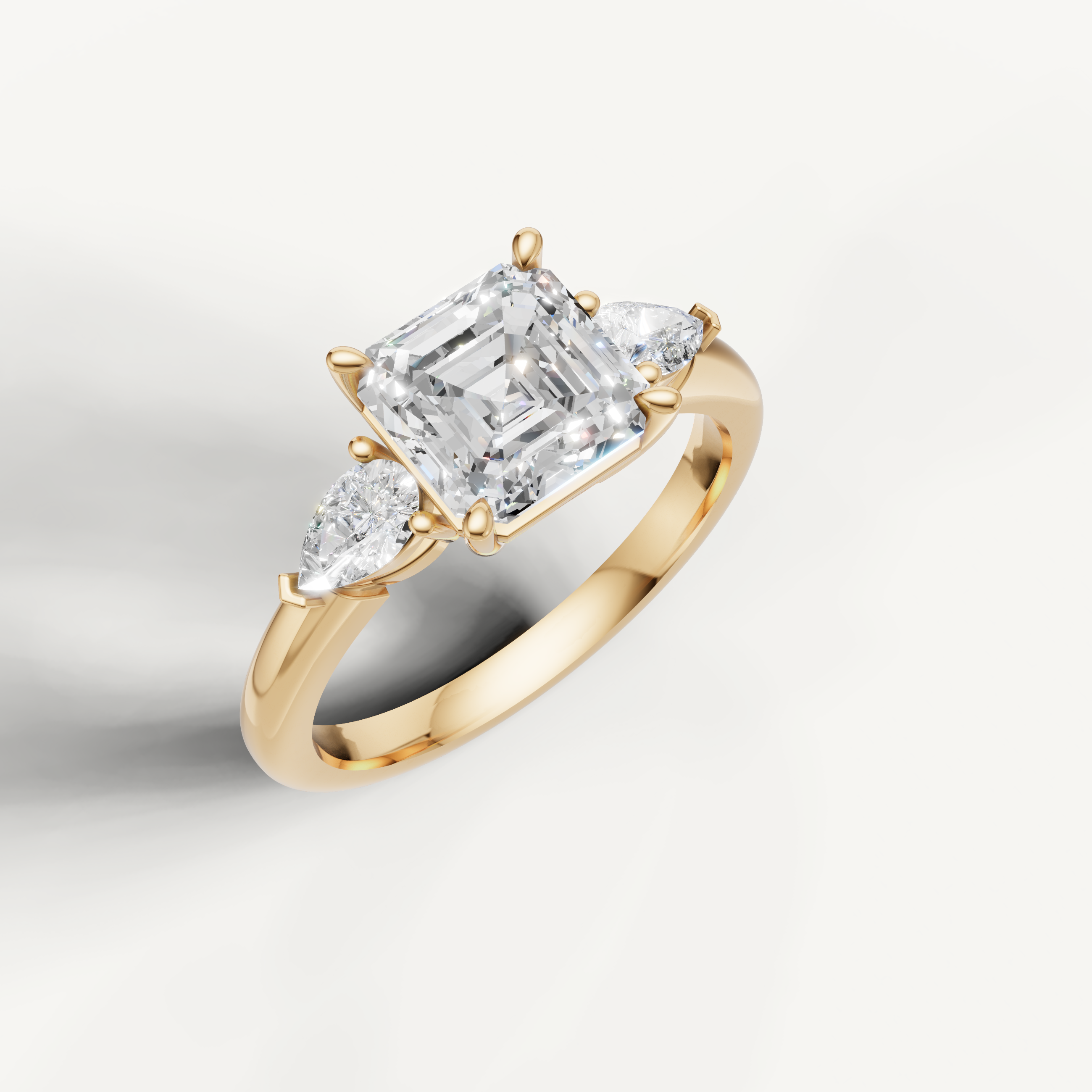 IGI certified asscher lab diamond three stone ring with pear sides 14k yellow gold
