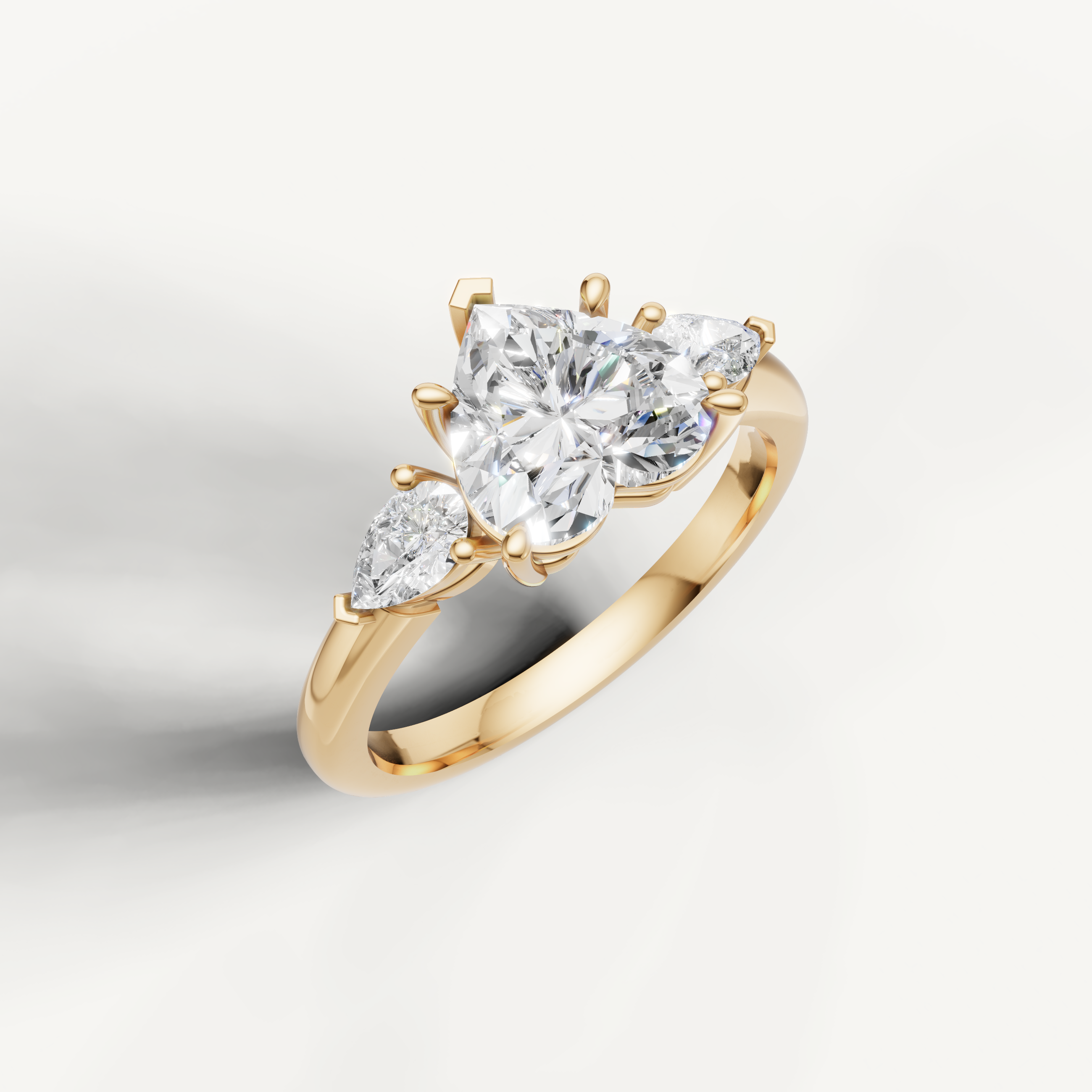 IGI certified heart shape lab diamond three stone ring with pear sides 14k yellow gold